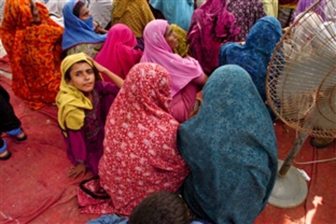Pakistani women receive information on personal hygiene at a settlement for flood victims in Pakistan, Aug. 25, 2010. The U.S. military is providing relief for residents displaced by the floods.