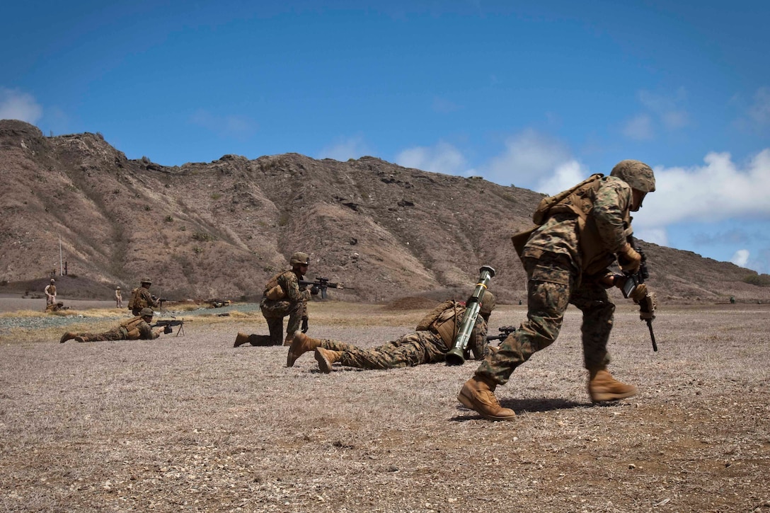 Students with the Infantry Squad Leader Course, School of Infantry West — Detachment Hawaii, move down range using buddy rushes during a live fire and maneuver assault at Range Training Facility Kaneohe Bay on Marine Corps Base Hawaii Aug. 26. “One of the most challenging things a Marine can do is lead their peers, and they’re forced to do that here,” said Staff Sgt. Michael Wissmeyer, staff noncommissioned officer in charge of ISLC. “When they leave here, we expect them to hold themselves to a higher standard and be ready to lead Marines in combat situations.”