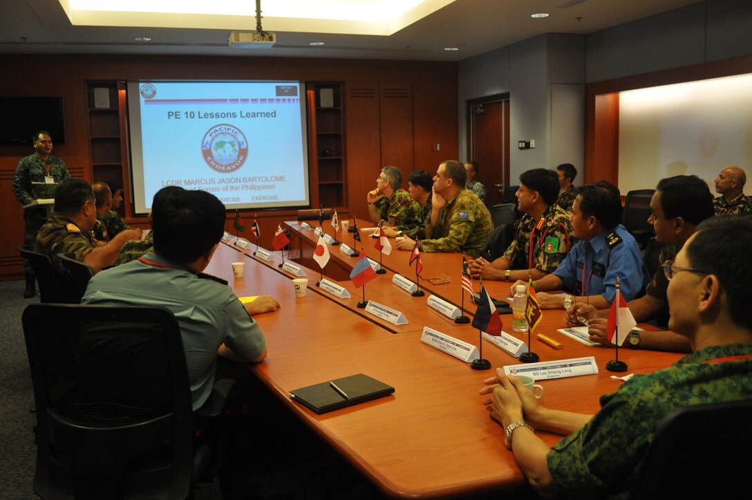 Armed Forces of the Philippines Navy Lt. Cmdr. Marcus Jason Bartolome gives a lessons learned presentation to senior military communicators from 16 Asia-Pacific nations during Pacific Endeavor workshop. Hosted by the Singapore Armed Forces and U.S. Pacific Command, Pacific Endeavor is a humanitarian communication workshop that brings together militaries, non-governmental organizations, and private sector to fully test communication methodologies during a natural disaster.