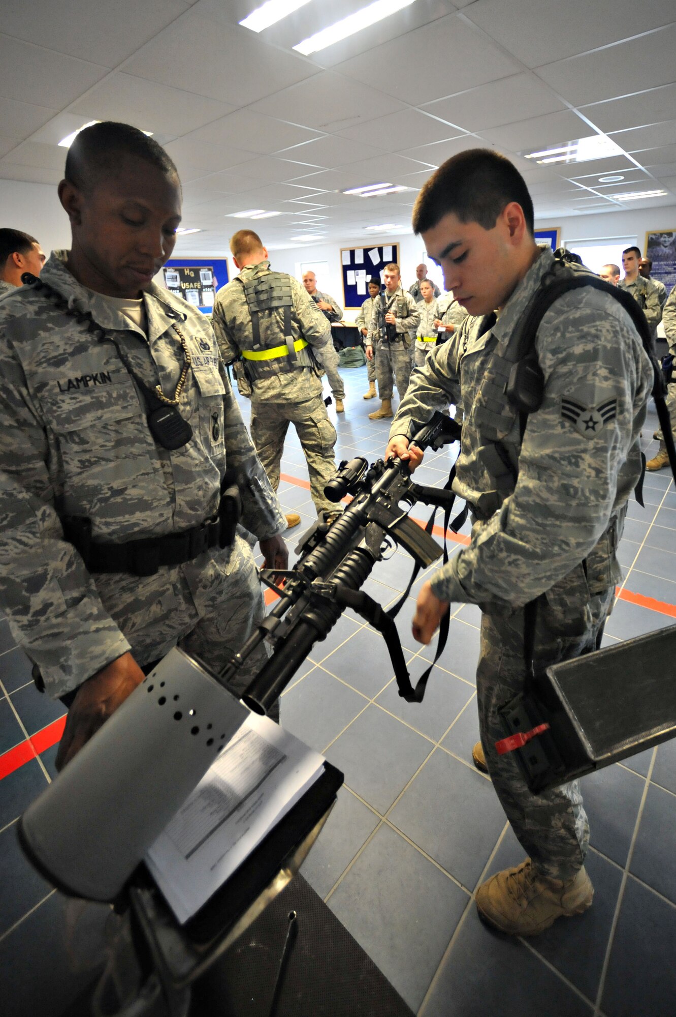 U.S. Air Force Senior Airman Vincent Gutierrez, 86th Security Forces Squadron, clears his weapon during an operational readiness exercise, Ramstein Air Base, Germany, Aug. 28, 2010. An ORE incorporates a series of scenarios to evaluate a base's ability to execute operational duties under simulated wartime conditions. (U.S. Air Force photo by Airman 1st Class Desiree Esposito)