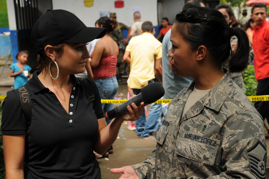 EL PICHICHE, El Salvador -- Maria Elisa Parker, the host of "Viva La Mañana" in El Salvador, interviews Master Sgt. Judy Santa Ana-Christian, with the Joint Task Force-Bravo Medical Element, during the medical civic action program here Aug. 24. Viva La Mañana is a program similar to "Good Morning America" in the U.S. (U.S. Air Force photo/Tech. Sgt. Benjamin Rojek)