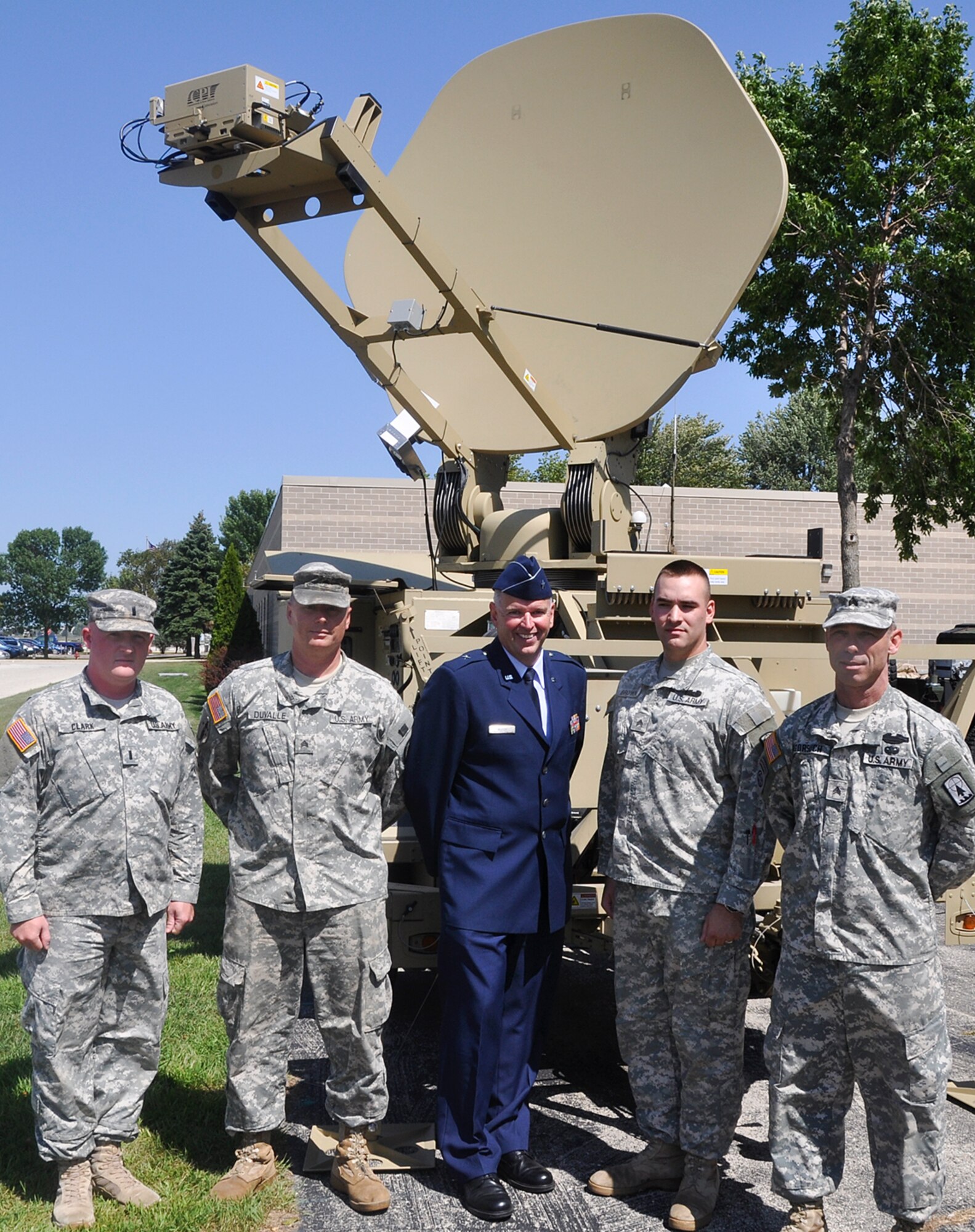 Brig. Gen. John E. McCoy, the assistant adjutant general for Air, stands beside Soldiers assigned to the 357th Network Support Company, 157th Maneuver Enhancement Brigade, Two Rivers, Wis., at the 128th Air Refueling Wing, Milwaukee, Wis., on Friday, August 27, 2010.  The service members participated in a tour of the air wing for the American Legion's National Security Commission.  (U.S. Air Force photo by Staff Sgt. Jeremy Wilson / Released)