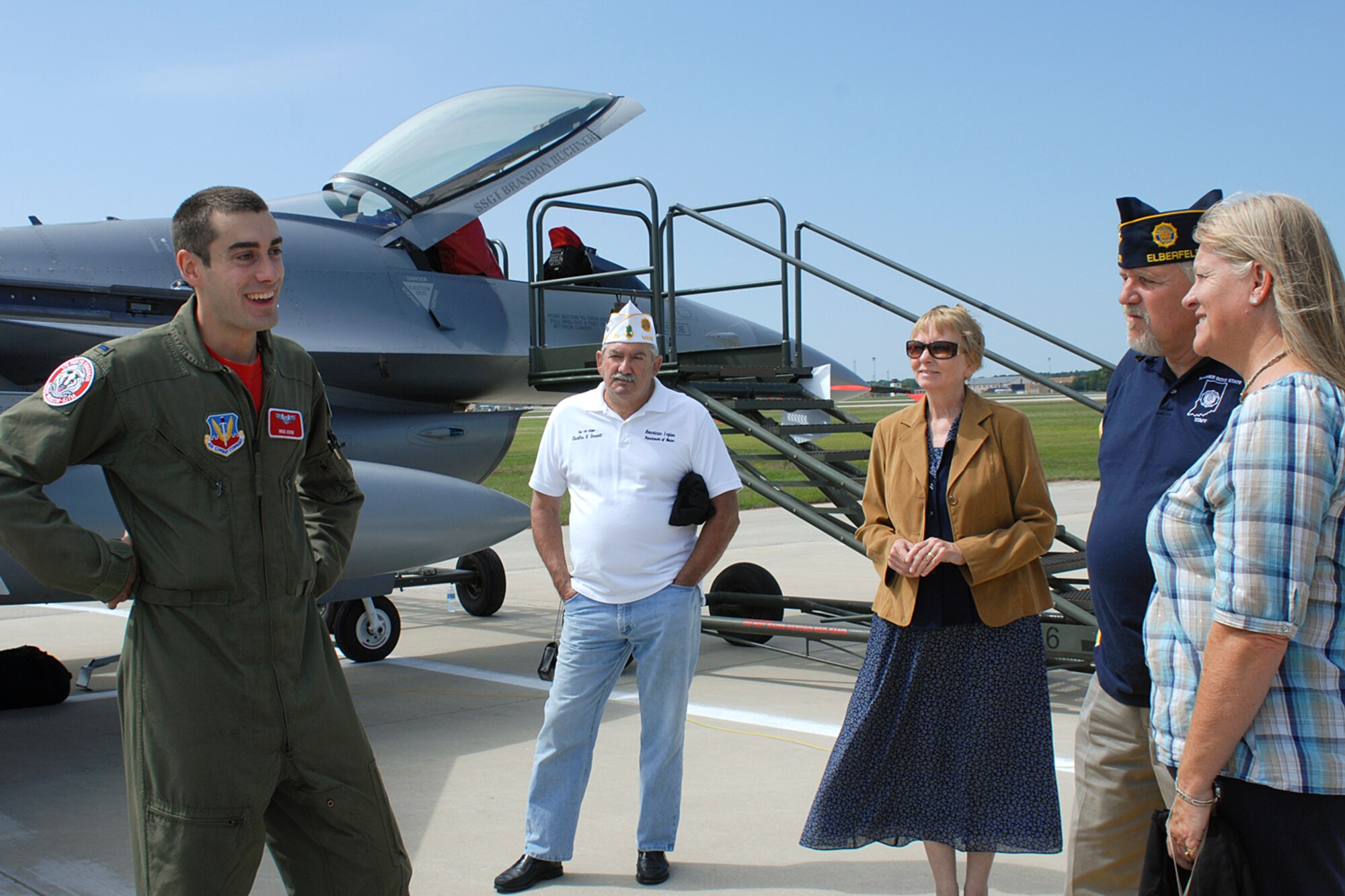 First Lieutenant Mike Koob, an F-16C pilot assigned to the 115th Fighter Wing, Madison, Wis., answers questions regarding his aircraft during an on-base tour at the 128th Air Refueling Wing, Milwaukee, Wis., on Friday, August 27, 2010.  The tour involved 48 members of the American Legion National Security Commission and involved other military assets on display.  (U.S. Air Force photo by Master Sgt. Kenneth Pagel / Released)