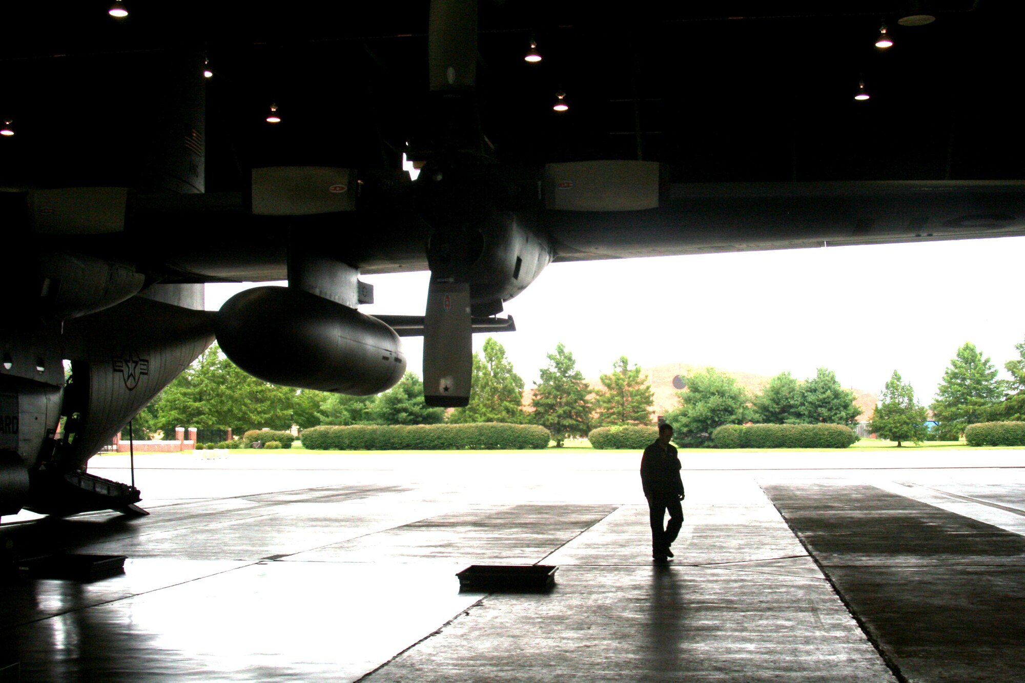 Master Sgt. John Gorsuch, C-130 Hercules loadmaster and instructor for Air Mobility Command's Detachment 5 at the Advanced Airlift Tactics Training Center at St. Joseph, Mo., looks over a C-130 aircraft display at Scott Air Force Base, Ill., on Aug. 20, 2010. (U.S. Air Force Photo/Master Sgt. Scott T. Sturkol)