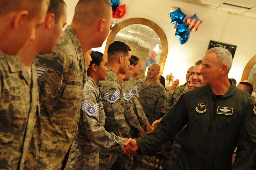 BARKSDALE AIR FORCE BASE, La. -- Maj. Gen. Floyd Carpenter, Eighth Air Force commander, congratulates Barksdale's newest staff sergeant selectees during the staff sergeant promotion party held at the Stripes Club Aug. 26. (U.S. Air Force photo by Senior Airman Joanna M. Kresge)(RELEASED) 
