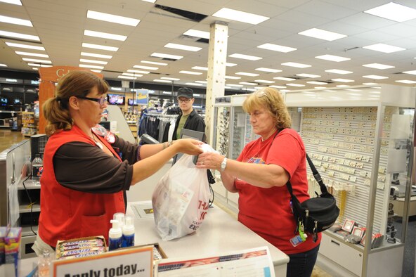 Lari Sasser, Army & Air Force Exchange Service cashier, helps Bev Ackley checkout Aug. 27 at the Base Exchange on Grand Forks Air Force Base, N.D. (U.S. Air Force photo by Staff Sgt. Suellyn F. Nuckolls)