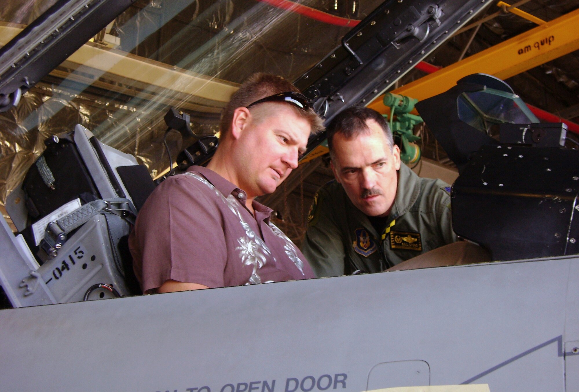 Col. Bill Lyons teaches Mr. Brandon Strong, recently named 419th Fighter Wing Citizen Partner, the complexities of the F-16 cockpit. The wing welcomed Mr. Strong and five other Citizen Partners, or honorary commanders, with a tour Aug. 26. The Citizen Partners will act as advocates for the wing and the Air Force Reserve, and serve as liaisons between the wing's Airmen and the local community. (U.S. Air Force photo/Bryan Magaña)