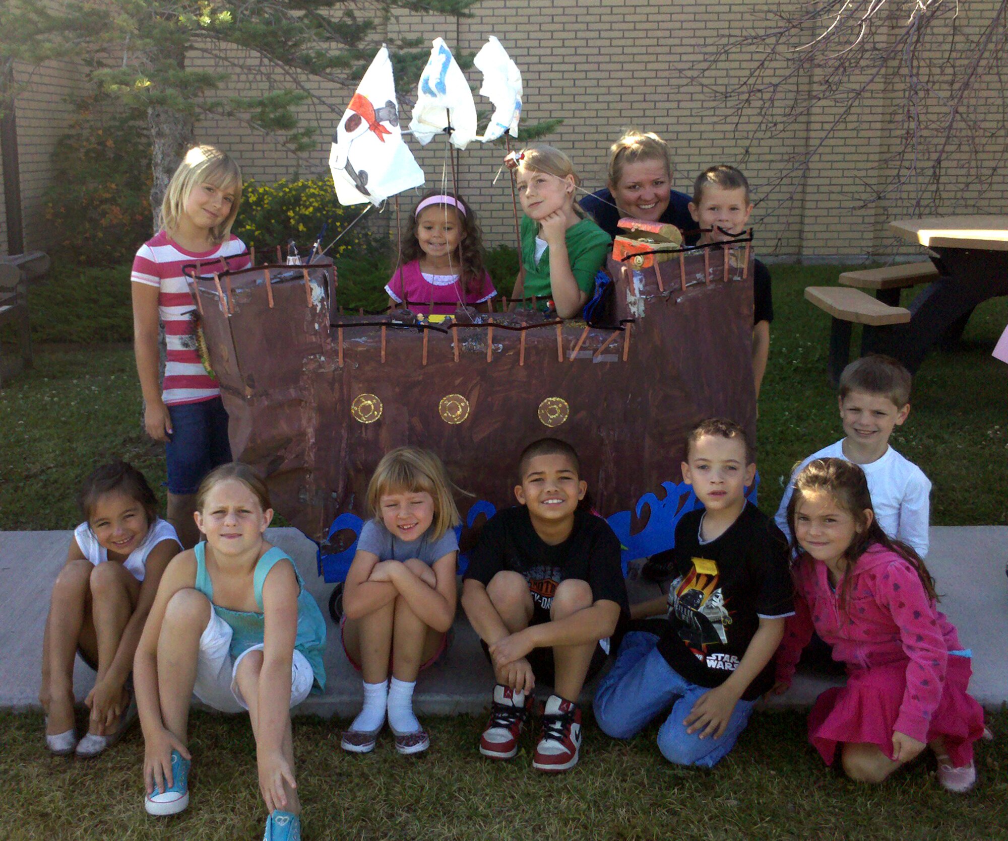 Team "Arr Matey! Book Pirates Don't Change Diapers," came in first place for the Summer Reading Program’s Book Cart Decorating Contest Aug. 14. The carts will be on display at the base library until Sept 1. Pictured clockwise from top left: Ashleigh Myers, Kylie Bickel, Brianna Edwards, Ms. Kendra Noble, Rafe Premo, Jackson Sauls, Kayla Hudson, Malcolm Alexander, Quincy Lacy-William, Haley Duncan, Lauren Small and Megan Toth.