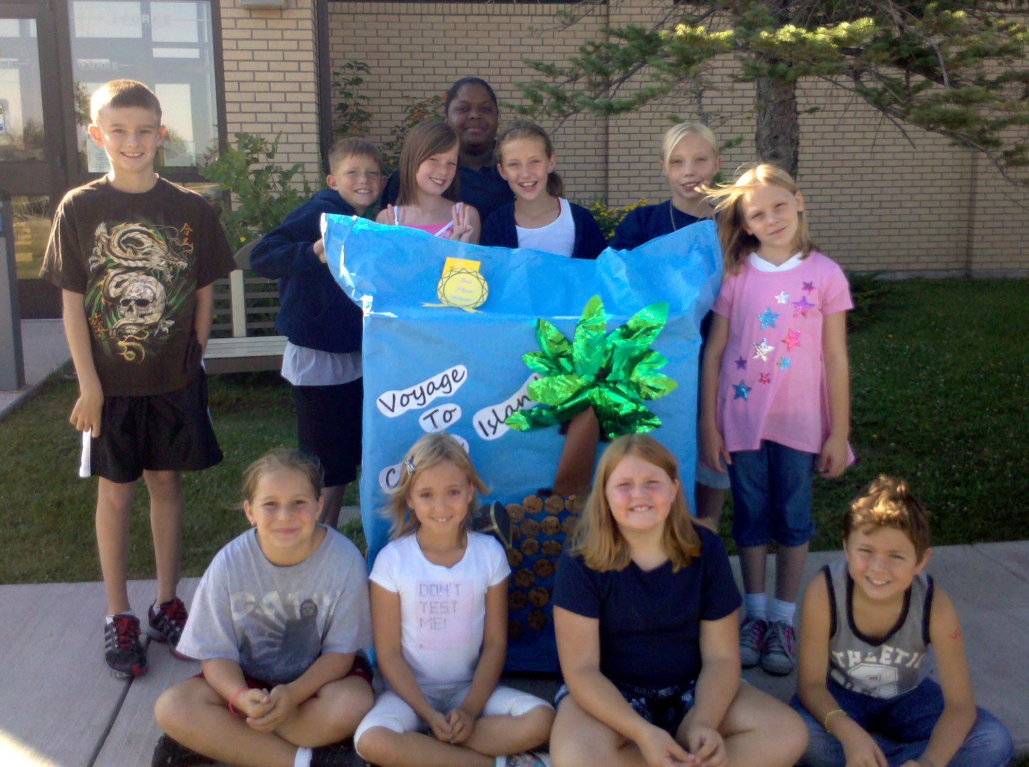 Members of Team Cookie Monster decorated a library book cart for the Summer Reading Program's contest Aug. 14 with the Youth Center. Pictured clockwise from top left: Anthony Clason, Conner Mora, Hannah Rearick, Ms. Omega Stackhouse, Quinn Mora, Morgan Duncan, Samantha Hohnecker, Jarrett Bratten, JJ Slater, Alaina Harelson and Amanda Chandler.