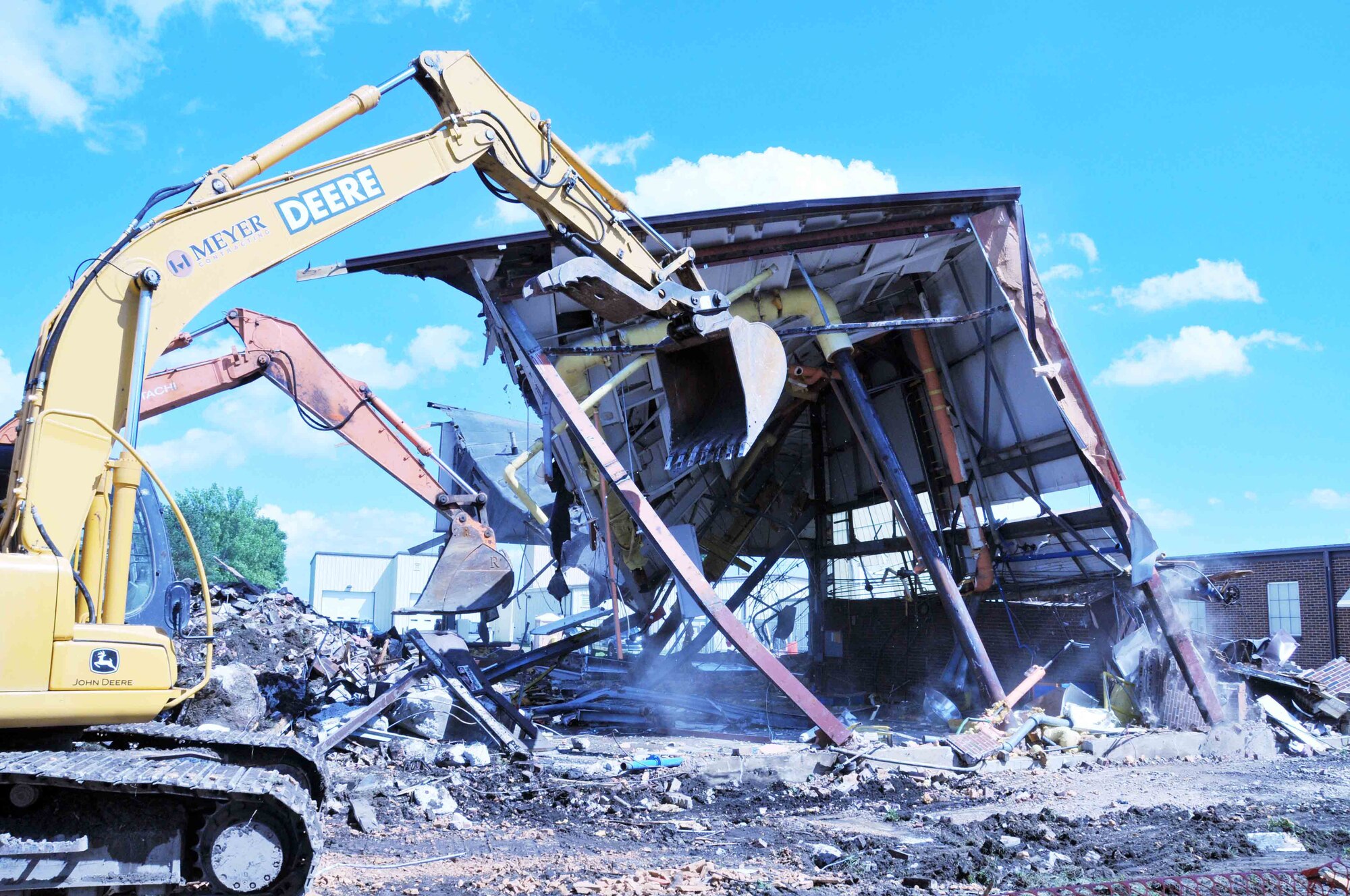 The old 934th Airlift Wing boiler plant is demolished Aug. 11 as new boilers are being installed to service individual buildings. The new boilers will allow more efficient heating of 934th facilities. (Air Force Photo/Paul Zadach)