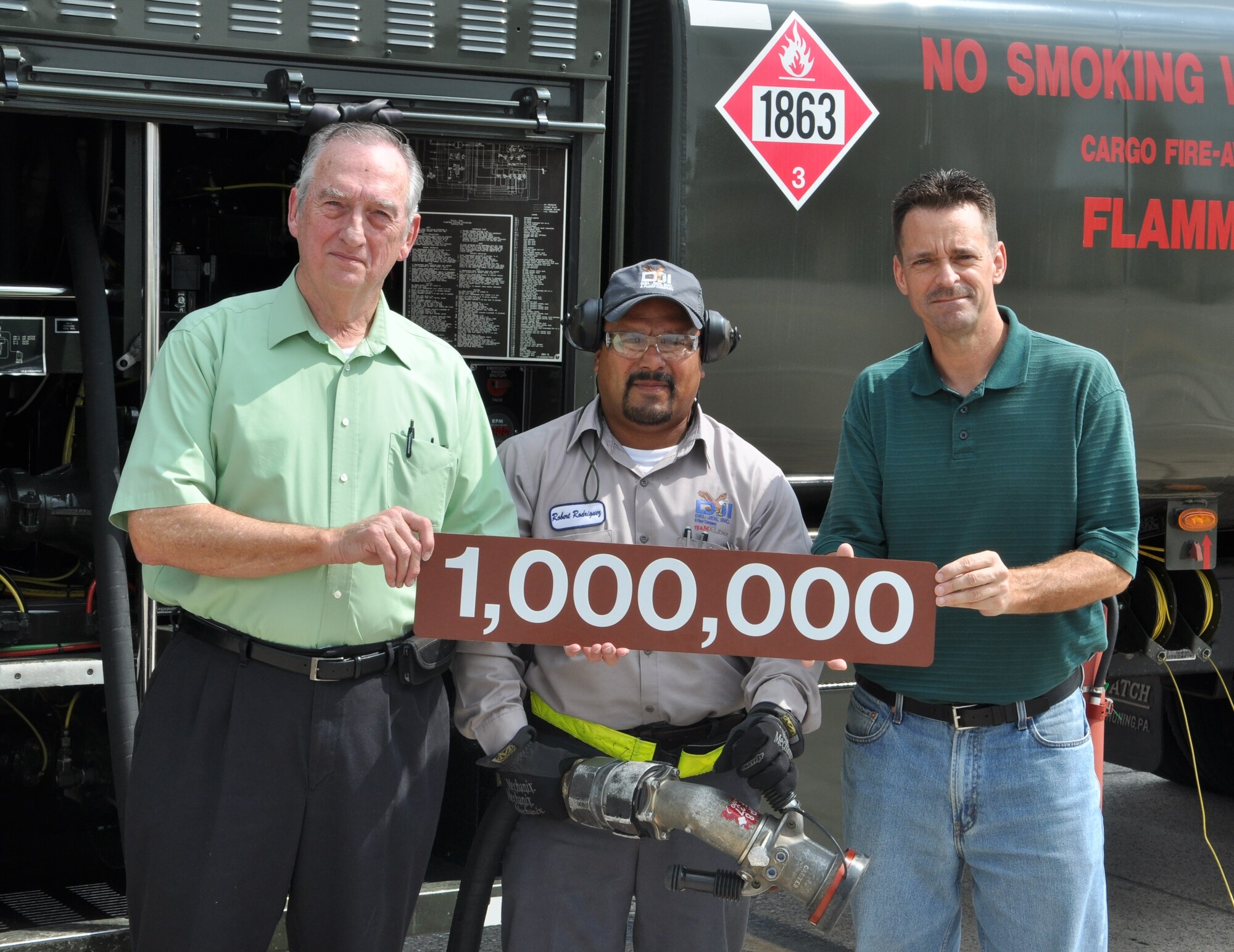 LAUGHLIN AIR FORCE BASE, Texas – Jerry Holt, Robert Rodriguez and Thomas Busch, all of the 47th Logistics Readiness Division, pose in front of the truck used to refuel the one-millionth Laughlin aircraft since the 47th LRD was contracted by the Air Force in 1991. Rodriguez refueled a T-38 at around 10:30 p.m.  Aug. 25 that served as the one-millionth servicing. (U.S. Air Force photo/Airman 1st Class Blake Mize)
