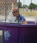 LAUGHLIN AIR FORCE BASE, Texas – Master Sgt. James Escher, 47th Security Forces Squadron, holds his breathe on his way into the dunk tank Aug. 26 during a “Burger Burn” at the Laughlin Chapel. Sergeant Escher is the first sergeant in SFS and with the help of other first sergeants across the base helped support the Chapel’s function. (U.S. Air Force Photo/ Staff Sgt. Desiree Economides)