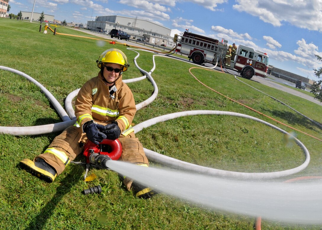 The Niagara Falls Reserve Station Fire Department practice spraying hoses, August 27, 2010, Niagara Falls Air Reserve Station, Niagara Falls, N.Y. Through constant training and practice the Niagara Falls Air Reserve Fire Department can stay prepared for any contingency.  (U.S. Air Force photo by Staff Sgt. Joseph McKee)