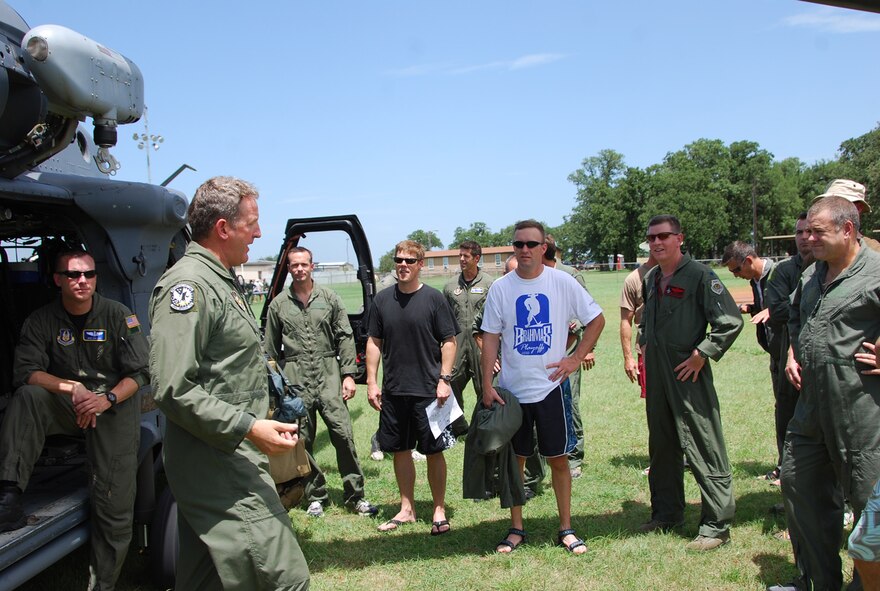 Pilots from the 457th Fighter Squadron, 301st Fighter Wing at Naval Air Station Fort Worth Joint Reserve Base, Texas, are given a safety briefing by SMSgt
Michael Flake, a member of the 305th Rescue Squadron, Davis-Monthan Air Force Base, Ariz., prior to being taken to the extraction point on Lake Worth July 11. There they will simulate being rescued by members of the 305th and 306th Rescue Squadron. This training is the first time they will experience rescue via an actual HH-60 "Pavehawk." (U.S. Air Force Photo/TSgt Shawn David McCowan)