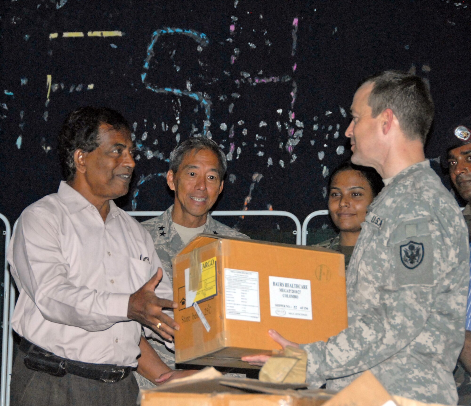 U.S. servicemembers participating in Operation Pacific Angel-Sri Lanka present Sri Lankan medical officials with donated medical supplies Aug. 21, 2010, at the conclusion of the Pacific Angel mission. More than 40 representatives from the Air Force, Army, Navy, Marines Corps and American public health service practitioners participated in the humanitarian effort. (U.S. Air Force photo/Master Sgt. Mike Hammond) 