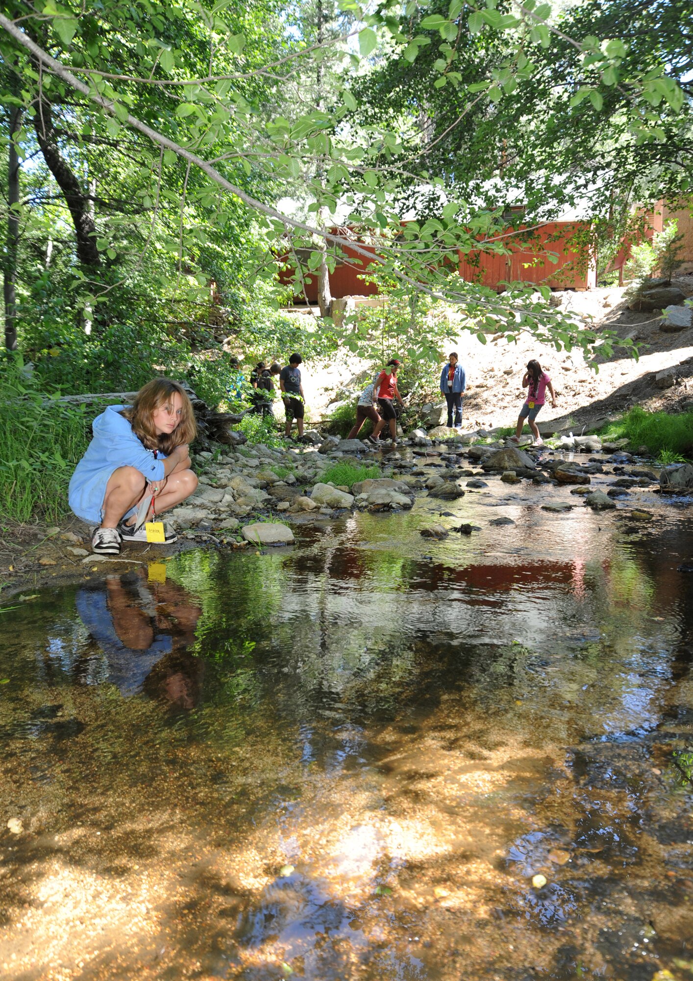 Ashley Anderson takes water samples as part of an environmental lesson at Camp Seeley, June 30.  Approximately 25 kids ranging from 9 years and up from the Los Angeles Air Force Base Youth Center spent a week at the camp participating in activities based  on 4-H’s science, engineering, technology, healthy living and citizenship curriculum. (Photo by Joe Juarez)