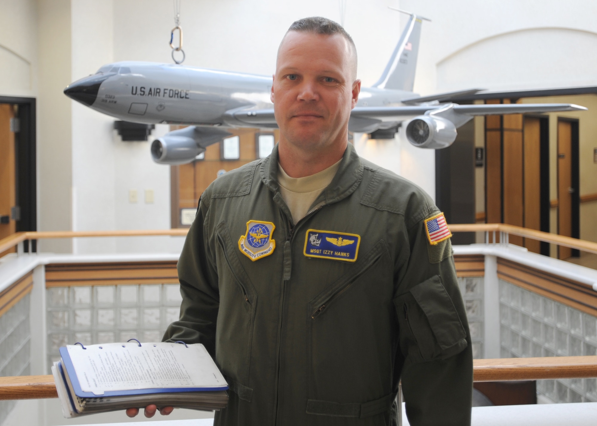 Master Sgt. Israel "Izzy" Hanks takes a moment to pose for a photo Aug. 25 in the 905th Air Refueling Squadron building. Sergeant Hanks is a boom operator and the Operations Superintendent for the 905th ARS at Grand Forks Air Force Base, N.D. When not at work his favorite activities include relaxing with his family, camping and working on his 1981 Chevy Full-size Blazer. (U.S. Air Force photo by Staff Sgt. Suellyn F. Nuckolls)
