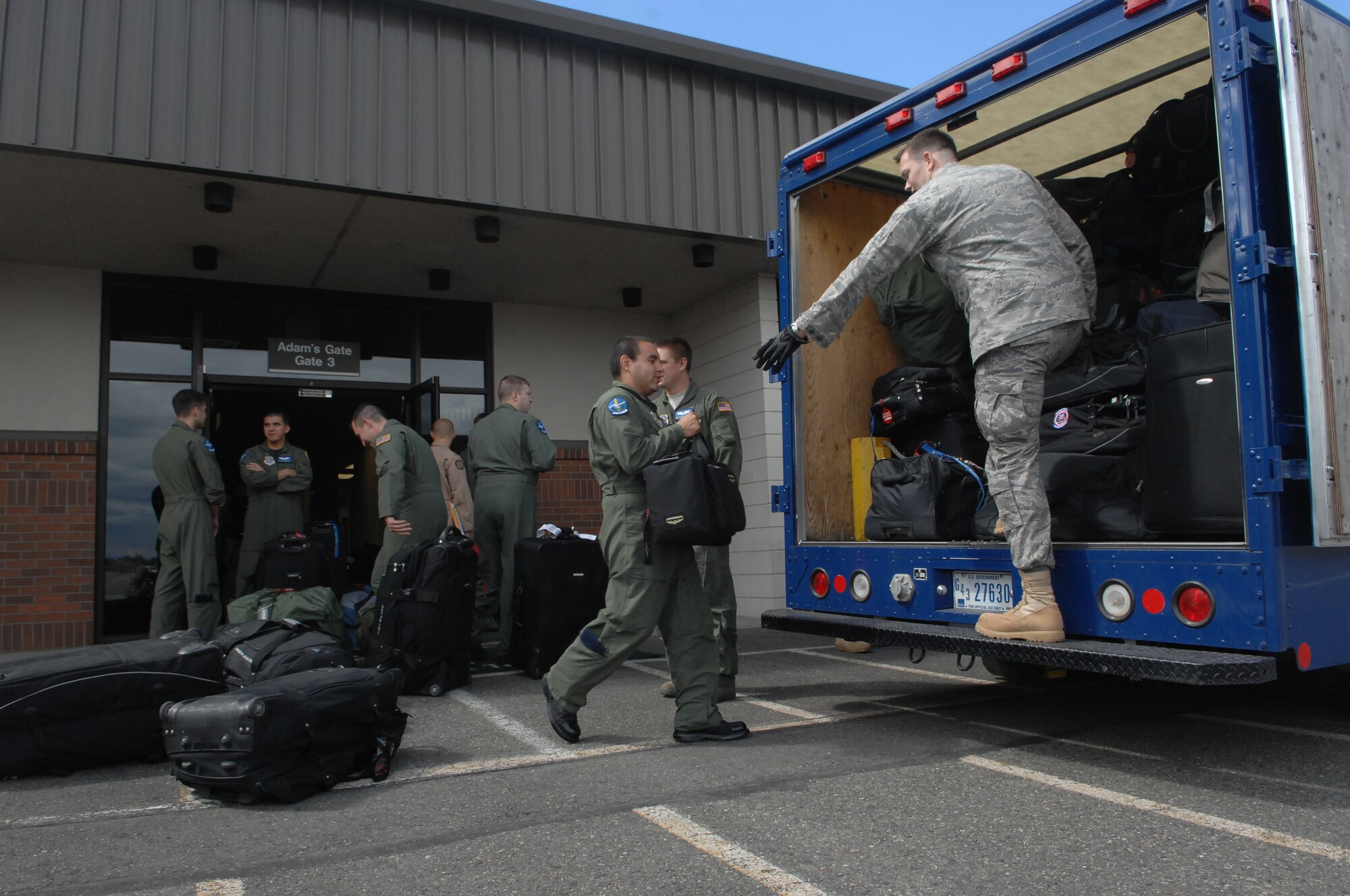 Airmen assigned to the 4th Airlift Squadron help load luggage onto a truck a few hours before a deployment Aug. 26 at Joint Base Lewis-McChord, Wash. More than 100 Airmen deployed in support of Operations Enduring Freedom and Iraqi Freedom. (U.S. Air Force Photo/Airman Leah Young)