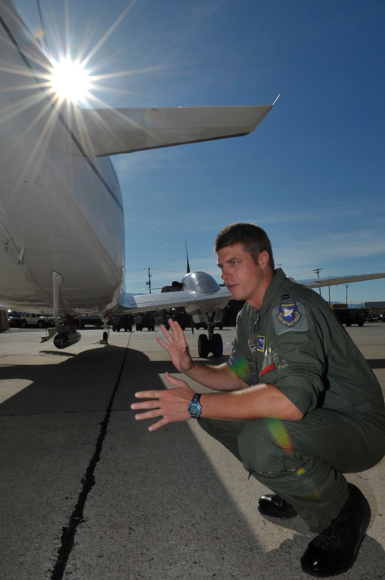 HOLLOMAN AIR FORCE BASE, N.M. -- Capt. Reid Larson explains details about an inert Laser Maverick attached to a highly-modified C-12J during an interview Aug. 25, 2010. The Laser Maverick is an air-to-ground missile that can seek out laser-designated targets. This is the first time the 586th Flight Test Squadron has tested external stores on the modified C-12J. Captain Larson is the Chief Flight Test Engineer with the 586th FLTS. (U.S. Air Force photo by Airman 1st Class Joshua Turner / Released)