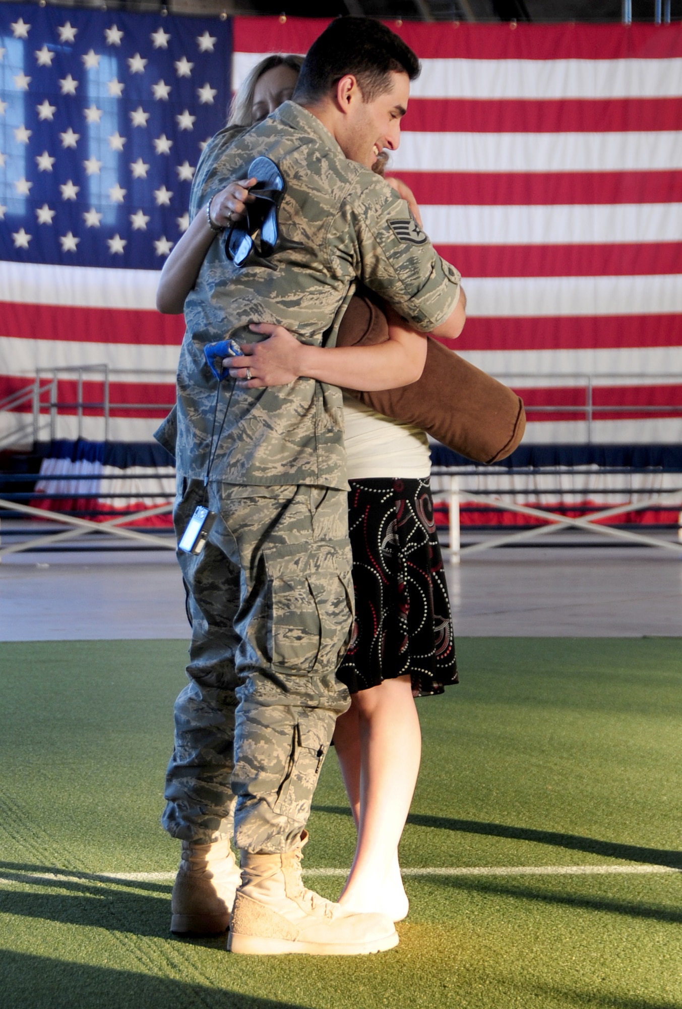 Staff Sgt. George Munoz hugs his wife, Christan, July 28, 2010, at Ellsworth Air Force Base, S.D., after returning from a deployment. Sergeant Munoz is an armament maintainer assigned to the 28th Munitions Squadron. (U.S. Air Force photo/Airman 1st Class Anthony Sanchelli)