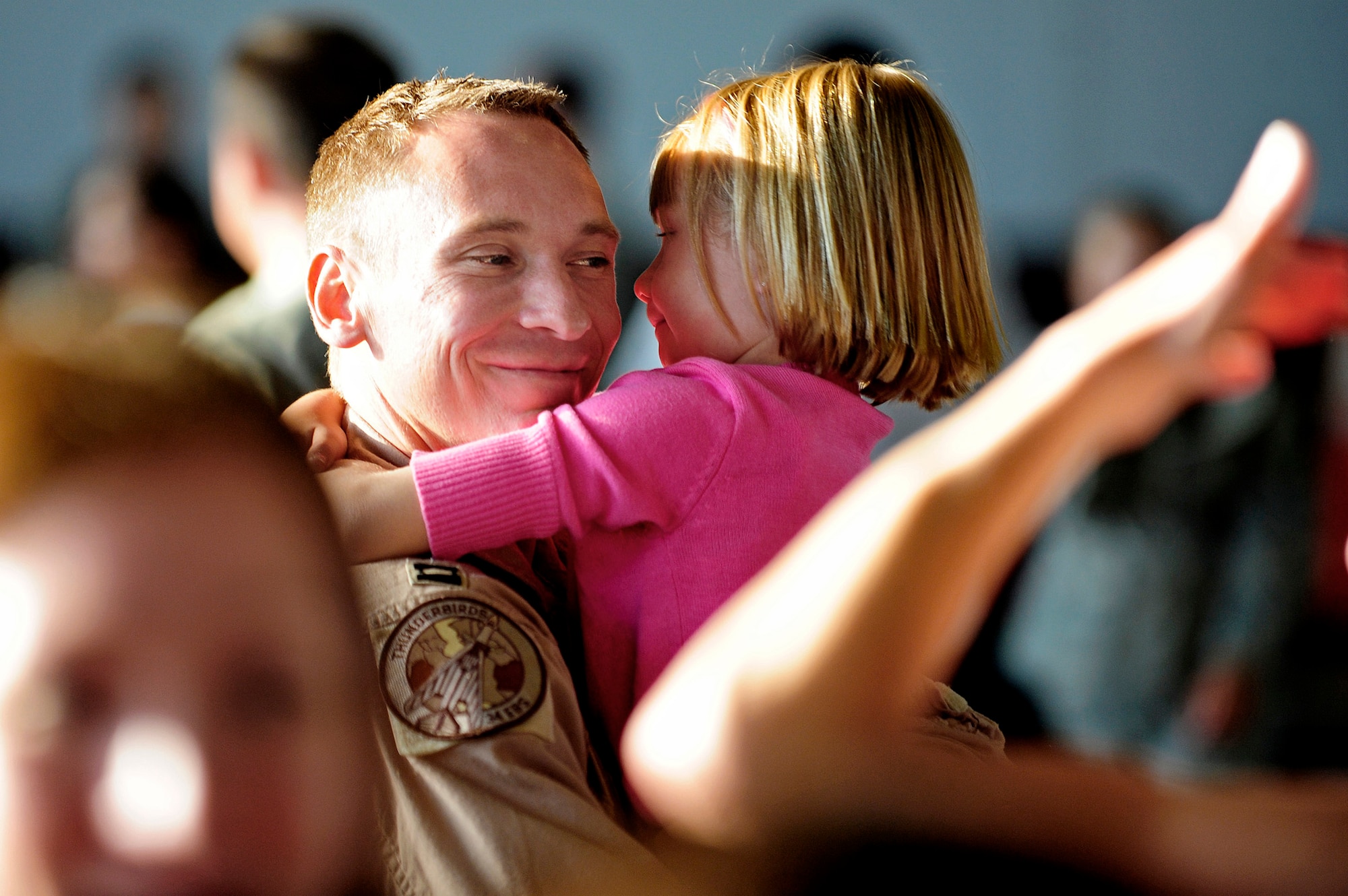 Staff Sgt. George Munoz hugs his wife, Christan, July 28, 2010, at Ellsworth Air Force Base, S.D., after returning from a deployment. Sergeant Munoz is an armament maintainer assigned to the 28th Munitions Squadron. (U.S. Air Force photo/Airman 1st Class Anthony Sanchelli)