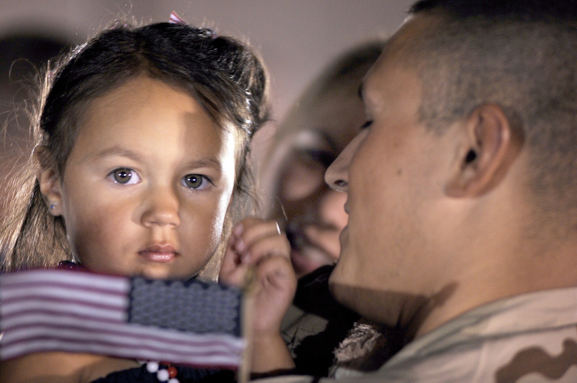 Staff Sgt. Anthony Cathcart is greeted by his daughter, Payton, and wife, Jaclyn, July 29, 2010, at Ellsworth Air Force Base, S.D., after returning from a deployment. Sergeant Cathcart is an aerospace maintenance jouneyman assigned to the 28th Aircraft Maintenance Squadron. (U.S. Air Force photo/Airman Corey Hook)