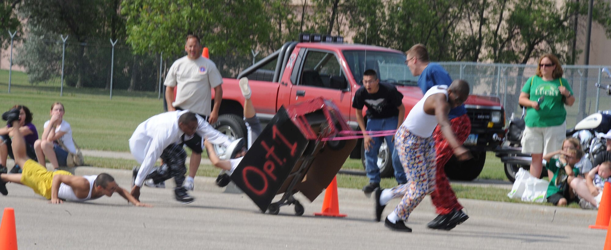 Members of the 319th Communications Squadron have trouble controlling their vehicle Aug. 19 during the bed race competition at the Grand Forks Air Force Base Summer Bash. (U.S. Air Force photo by Airman 1st Class Amber E. Price)