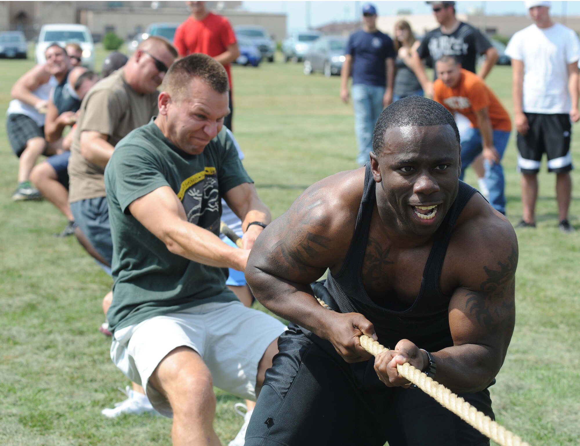 Staff Sgt. Patrick A. Holmes and other members of the 319th Civil Engineer Squadron compete in the tug-o-war competition Aug. 19 at the Grand Forks Air Force Base Summer Bash. (U.S. Air Force photo by Airman 1st Class Amber E. Price)