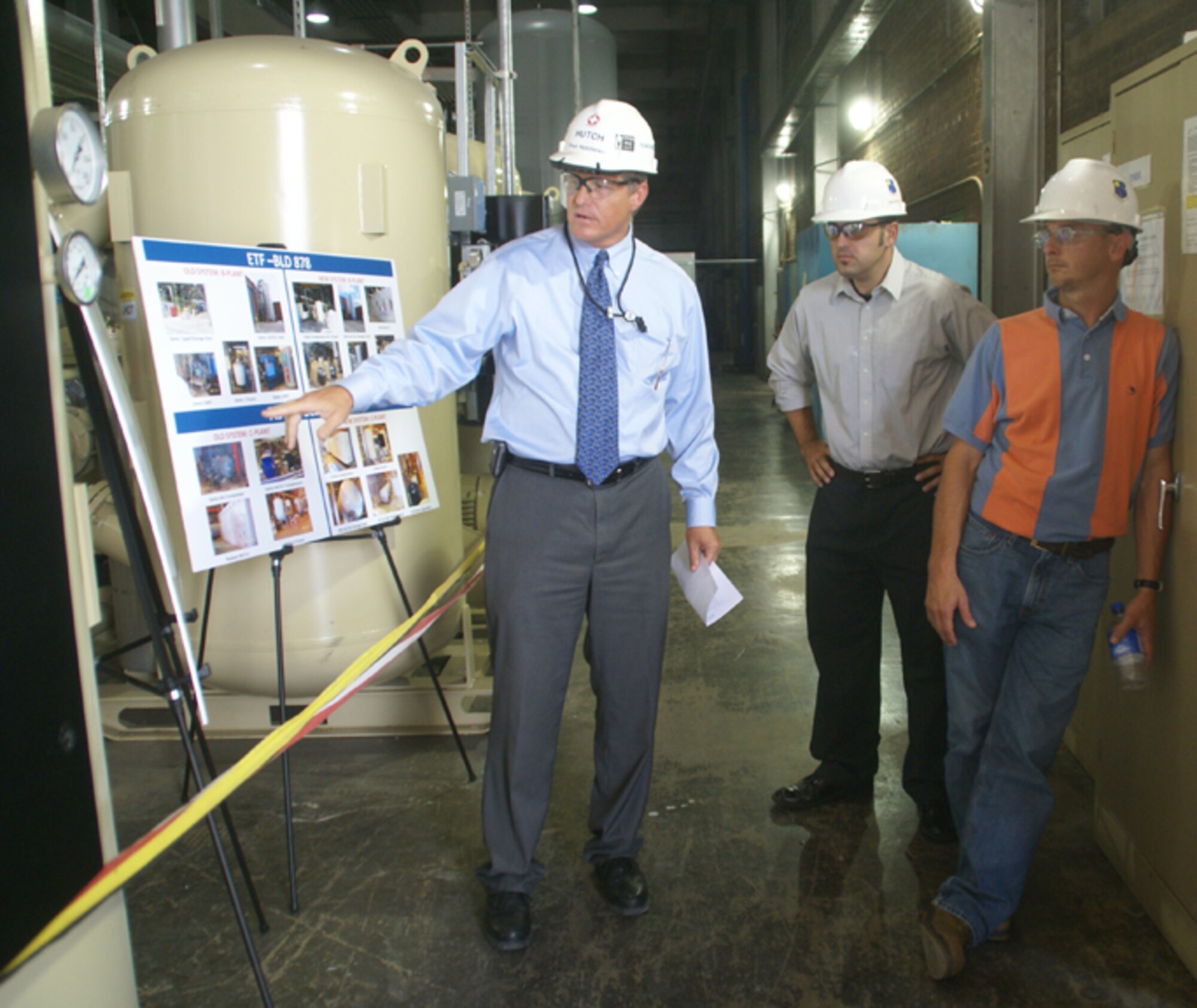 Arnold Engineering Development Center’s Fred Hutchinson talks about ongoing changes being made to the original system supplying service air to the base with Brandon Lucy, who was the Air Force project manager on the upgrade at the time. To Lucy’s right is Mike Harvey, an engineer with ATA’s Mechanical Systems Engineering Branch, who is also working with the service air system upgrade. Hutchison is a project manager for ATA’s project and design engineering department at AEDC. (Photo by Philip Lorenz III)
