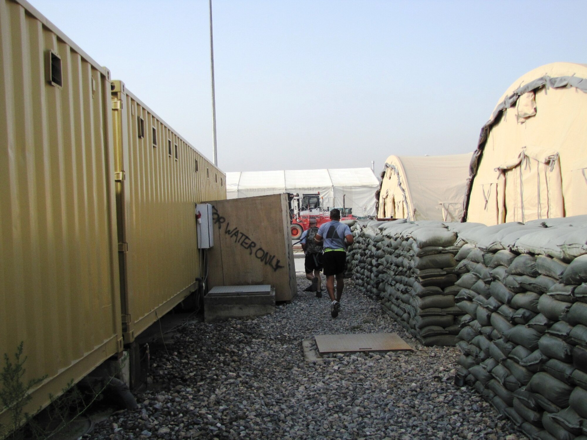 KABUL, Afghanistan - Airmen from the Combined Air Power Transition Force participate in the "Amazing Race" event held jointly at the International Security Assistance Force and Afghan Air Force base's on Aug. 27, 2010. The race was both physically and mentally challenging as the contestants would decipher clues that would lead them to the variety of mixed events during the race including volleyball, face paint and blind ball toss, map reading. (U.S. Air Force photo by Capt. Rob Leese/RELEASED).