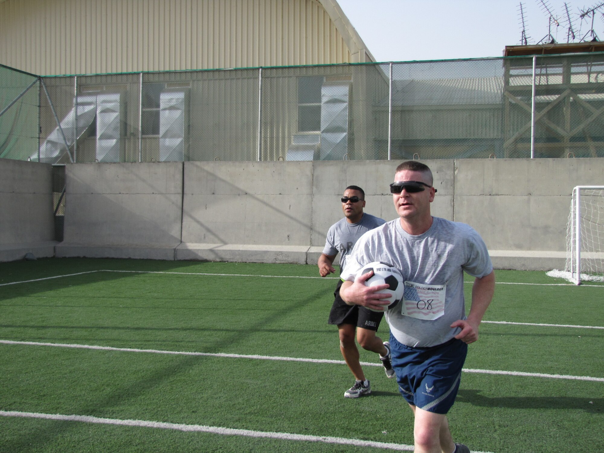 KABUL, Afghanistan - Airmen from the Combined Air Power Transition Force participate in the "Amazing Race" event held jointly at the International Security Assistance Force and Afghan Air Force base's on Aug. 27, 2010. The race was both physically and mentally challenging as the contestants would decipher clues that would lead them to the variety of mixed events during the race including volleyball, face paint and blind ball toss, map reading. (U.S. Air Force photo by Capt. Rob Leese/RELEASED).