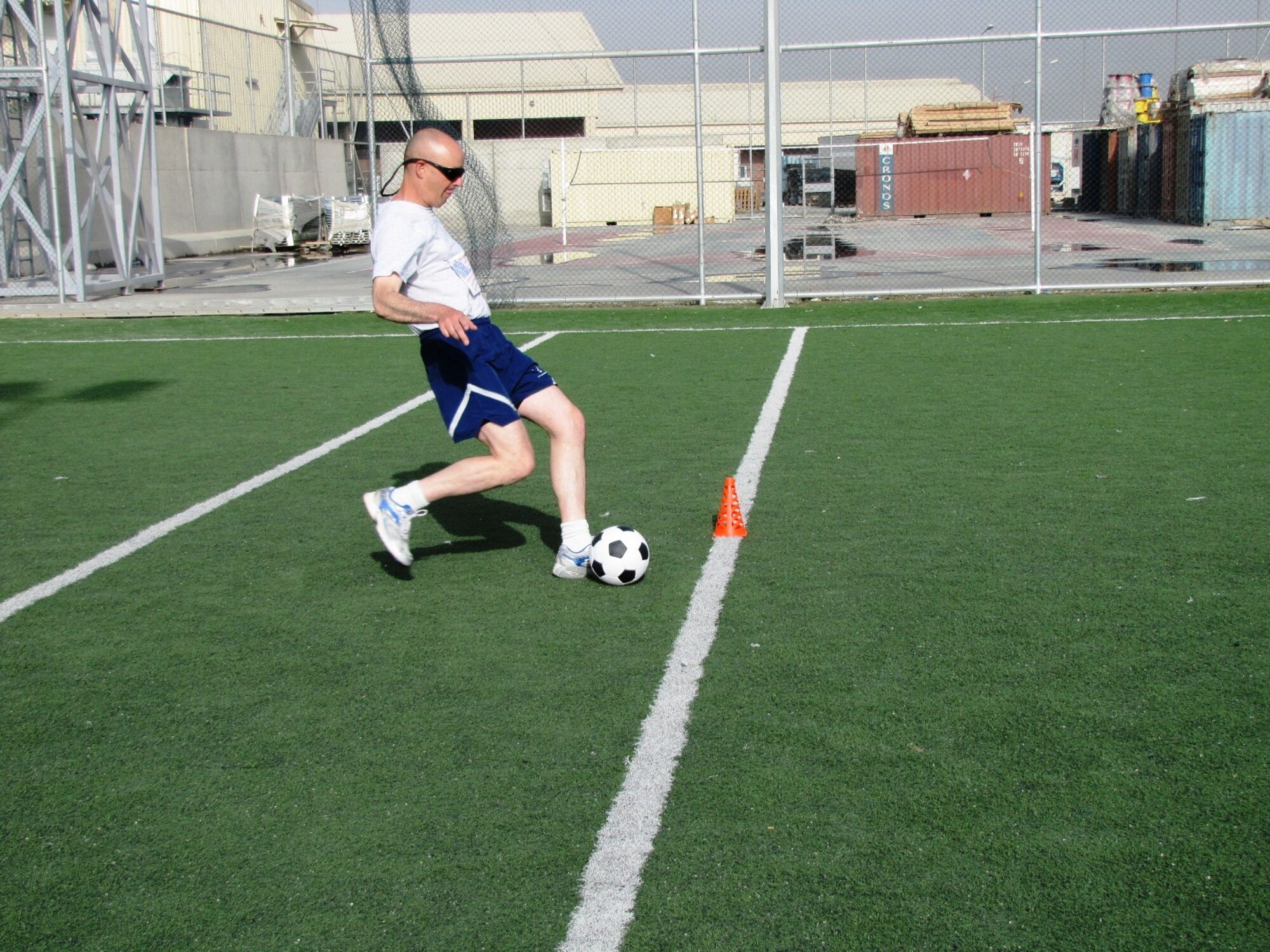 KABUL, Afghanistan - Airmen from the Combined Air Power Transition Force participate in the "Amazing Race" event held jointly at the International Security Assistance Force and Afghan Air Force base's on Aug. 27, 2010. The race was both physically and mentally challenging as the contestants would decipher clues that would lead them to the variety of mixed events during the race including volleyball, face paint and blind ball toss, map reading. (U.S. Air Force photo by Capt. Rob Leese/RELEASED).