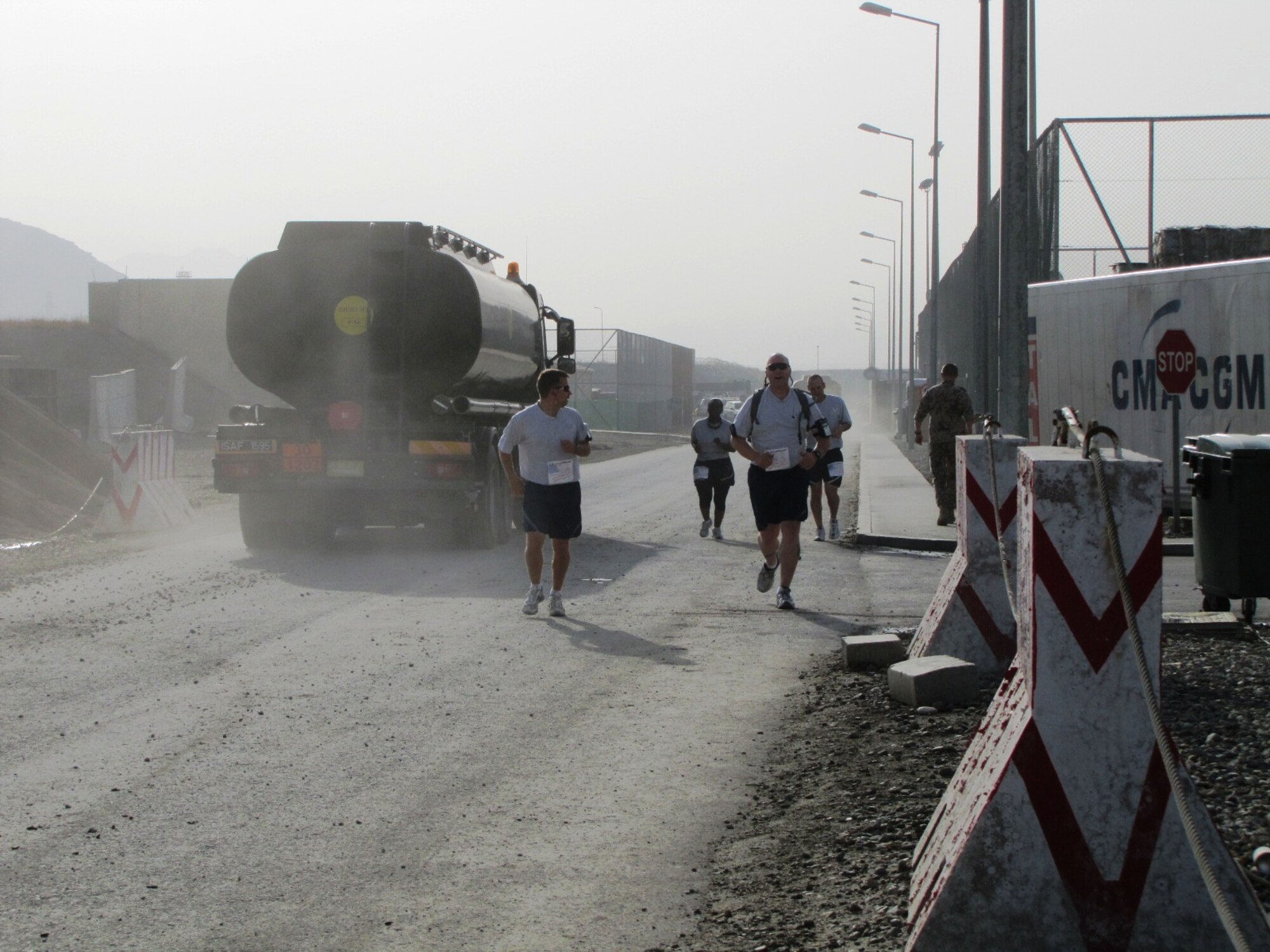 KABUL, Afghanistan - Airmen from the Combined Air Power Transition Force participate in the "Amazing Race" event held jointly at the International Security Assistance Force and Afghan Air Force base's on Aug. 27, 2010. The race was both physically and mentally challenging as the contestants would decipher clues that would lead them to the variety of mixed events during the race including volleyball, face paint and blind ball toss, map reading. (U.S. Air Force photo by Capt. Rob Leese/RELEASED).