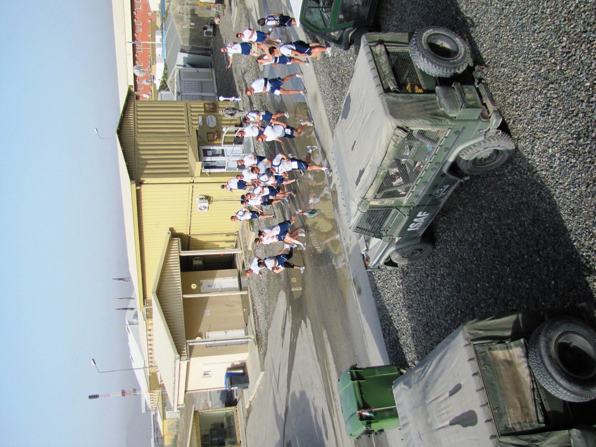 KABUL, Afghanistan - Airmen from the Combined Air Power Transition Force participate in the "Amazing Race" event held jointly at the International Security Assistance Force and Afghan Air Force base's on Aug. 27, 2010. The race was both physically and mentally challenging as the contestants would decipher clues that would lead them to the variety of mixed events during the race including volleyball, face paint and blind ball toss, map reading. (U.S. Air Force photo by Capt. Rob Leese/RELEASED).
