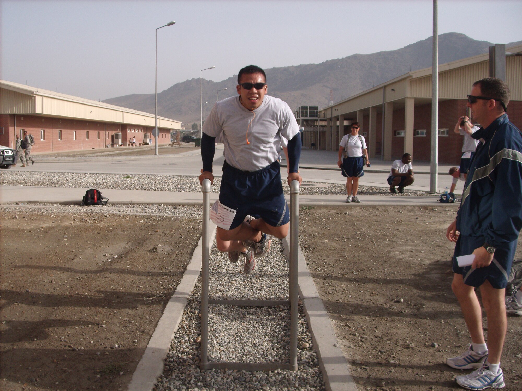 KABUL, Afghanistan - Airmen from the Combined Air Power Transition Force participate in the "Amazing Race" event held jointly at the International Security Assistance Force and Afghan Air Force base's on Aug. 27, 2010. The race was both physically and mentally challenging as the contestants would decipher clues that would lead them to the variety of mixed events during the race including volleyball, face paint and blind ball toss, map reading. (U.S. Air Force photo by Capt. Rob Leese/RELEASED).