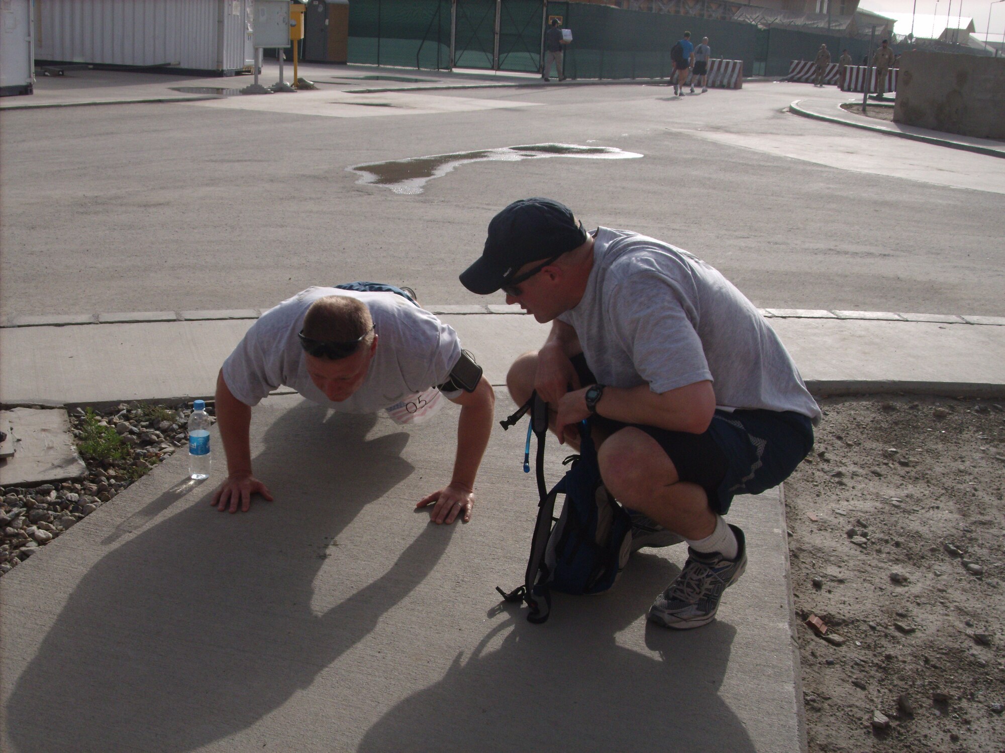 KABUL, Afghanistan - Airmen from the Combined Air Power Transition Force participate in the "Amazing Race" event held jointly at the International Security Assistance Force and Afghan Air Force base's on Aug. 27, 2010. The race was both physically and mentally challenging as the contestants would decipher clues that would lead them to the variety of mixed events during the race including volleyball, face paint and blind ball toss, map reading. (U.S. Air Force photo by Capt. Rob Leese/RELEASED).