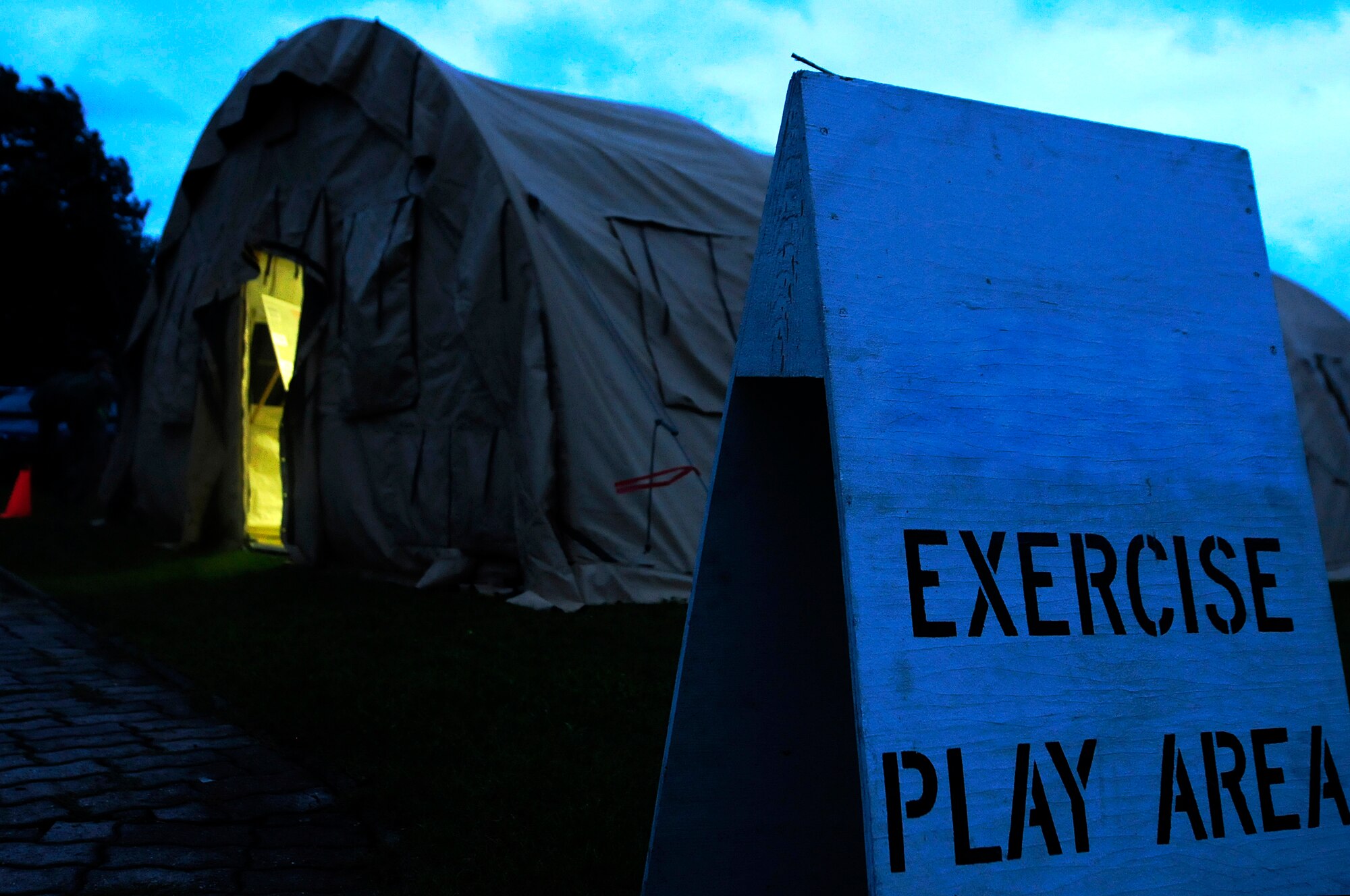 A military member approaches the entry control point (ECP) during an operational readiness exercise (ORE) at Ramstein Air Base, Germany, Aug. 27, 2010. The ECP provides updated information to ORE particpants. (U.S. Air Force photo by Airman 1st Class Brea Miller)