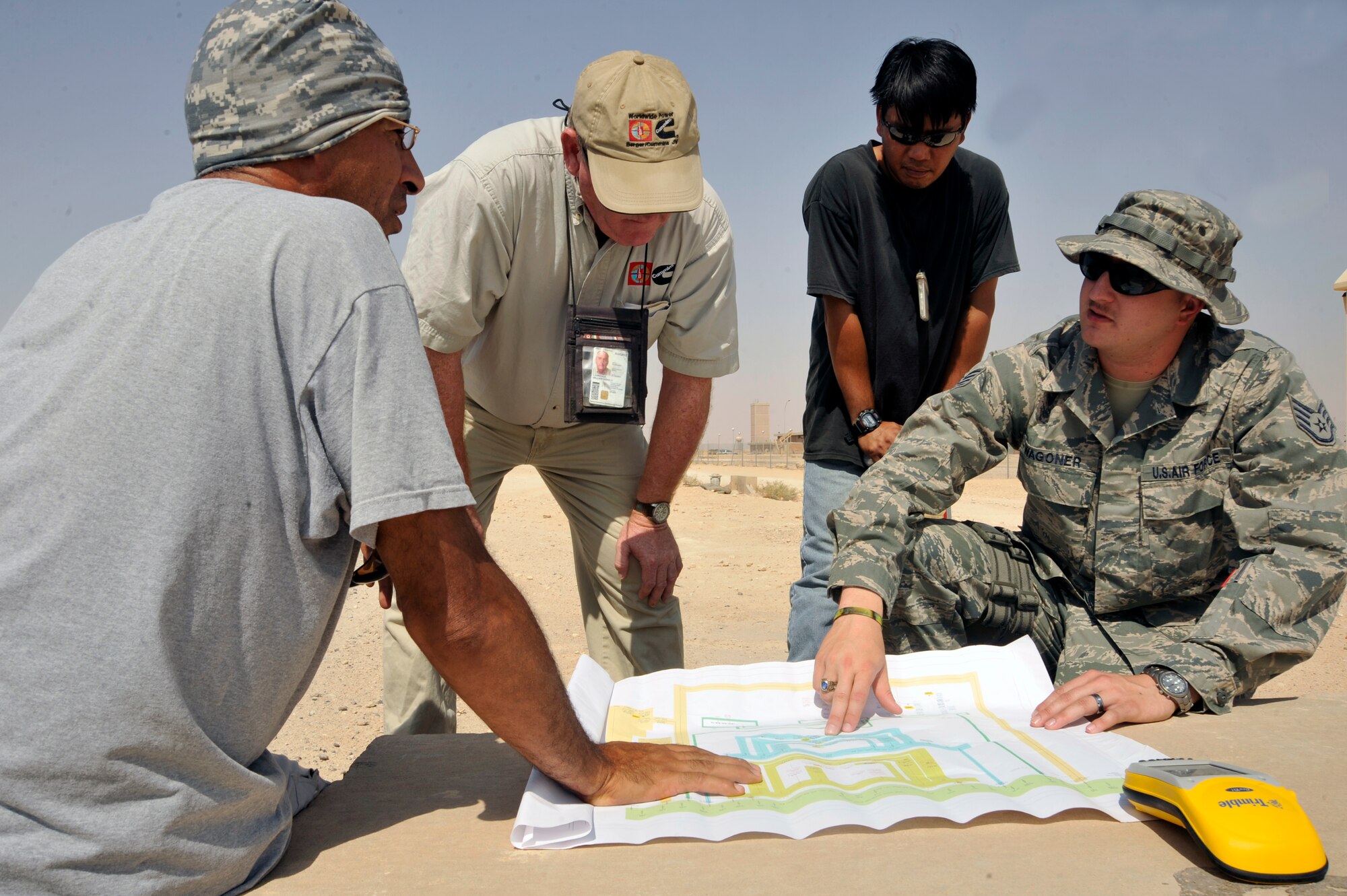 Staff Sgt. Teddy Wagner, 732nd Expeditionary PRIME BEEF Squadron Facility Engineer Team engineer assistant, points out which power lines he needs to plot Aug. 17, 2010 at Al Asad Air Base, Iraq. Sergeant Wagner is plotting the locations of power lines, so he can draw them on a map. Updated maps are needed as the U.S Forces footprint continues to change during the responsible drawdown of forces. Eventually Al Asad AB will be returned to the Iraqis as part of the Strategic Framework Agreement. (U.S. Air Force photo by Senior Airman Perry Aston) (Released)