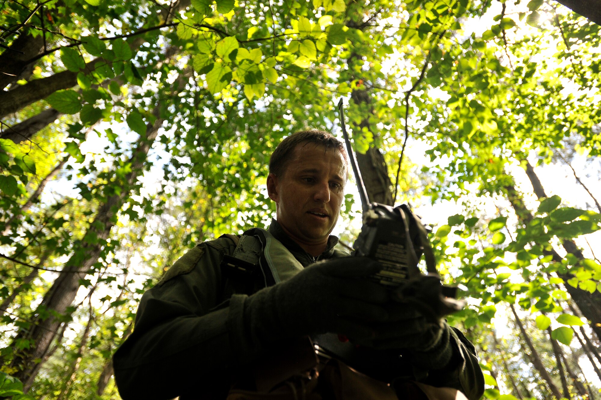 MISAWA AIR BASE, Japan -- Capt. Don Davenport,  13th Fighter Squadron F-16 pilot, checks his global positioning system receiver for coordinates during combat survival training Aug. 26. CST helps reacquaint pilots and aircrew personnel with the necessary skills to survice in case of an emergency. (U.S. Air Force photo/Staff Sgt. Chad C. Strohmeyer)