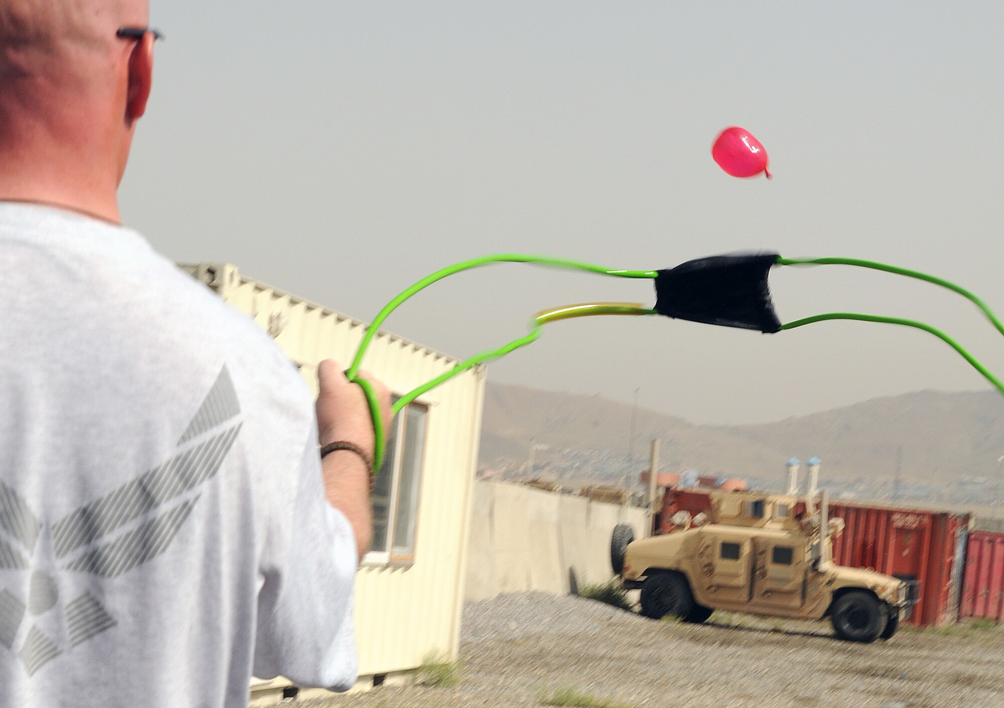 100827-N-6031Q-020 KABUL, Afghanistan - Airmen from the Combined Air Power Transition Force participate in the "Amazing Race" event held jointly at the International Security Assistance Force and Afghan Air Force base's on Aug. 27, 2010. The race was both physically and mentally challenging as the contestants would decipher clues that would lead them to the variety of mixed events during the race including volleyball, face paint and blind ball toss, map reading. (US Navy photo by Mass Communication Specialist 2nd Class David Quillen/ RELEASED).