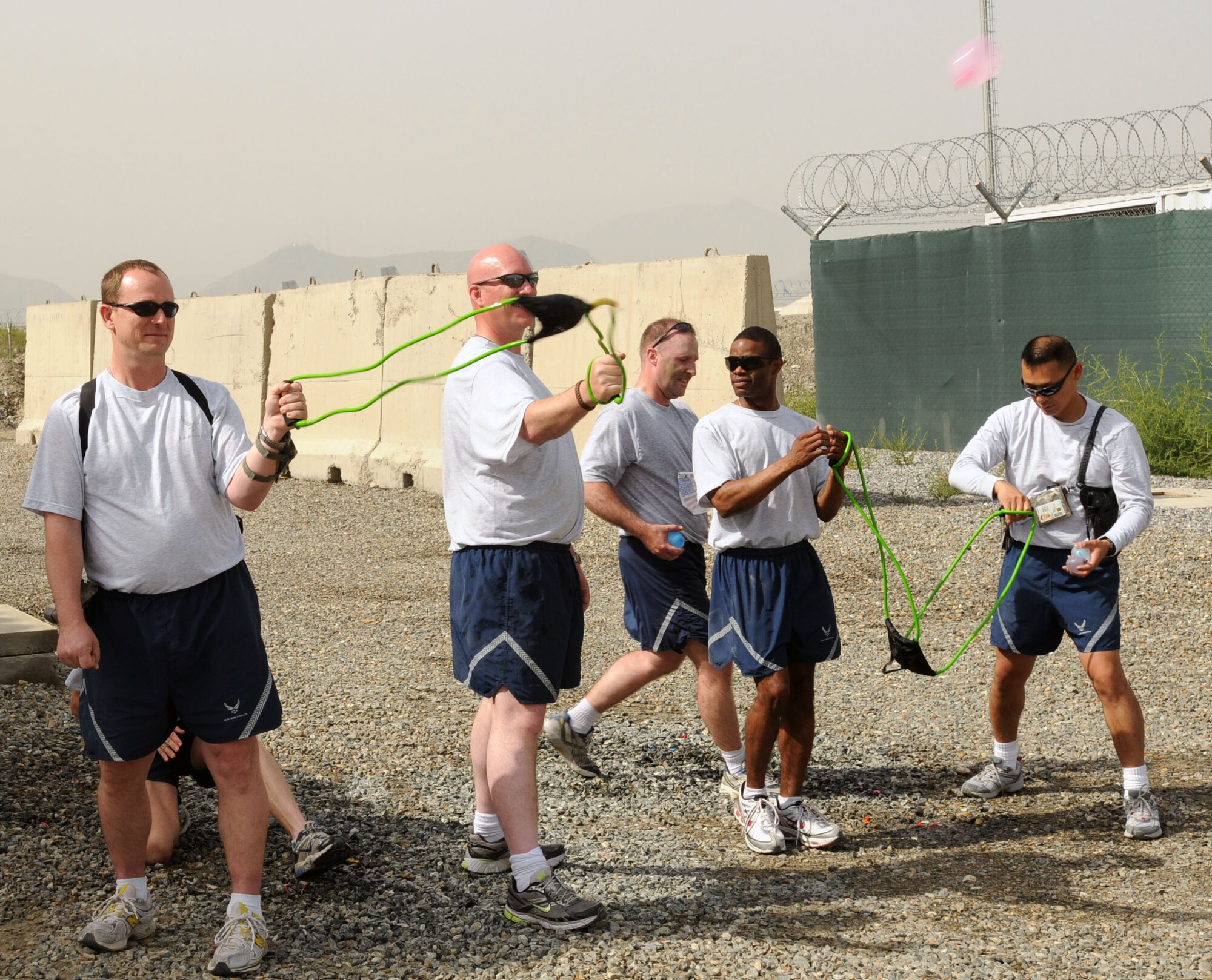 100827-N-6031Q-019 KABUL, Afghanistan - Airmen from the Combined Air Power Transition Force participate in the "Amazing Race" event held jointly at the International Security Assistance Force and Afghan Air Force base's on Aug. 27, 2010. The race was both physically and mentally challenging as the contestants would decipher clues that would lead them to the variety of mixed events during the race including volleyball, face paint and blind ball toss, map reading. (US Navy photo by Mass Communication Specialist 2nd Class David Quillen/ RELEASED).
