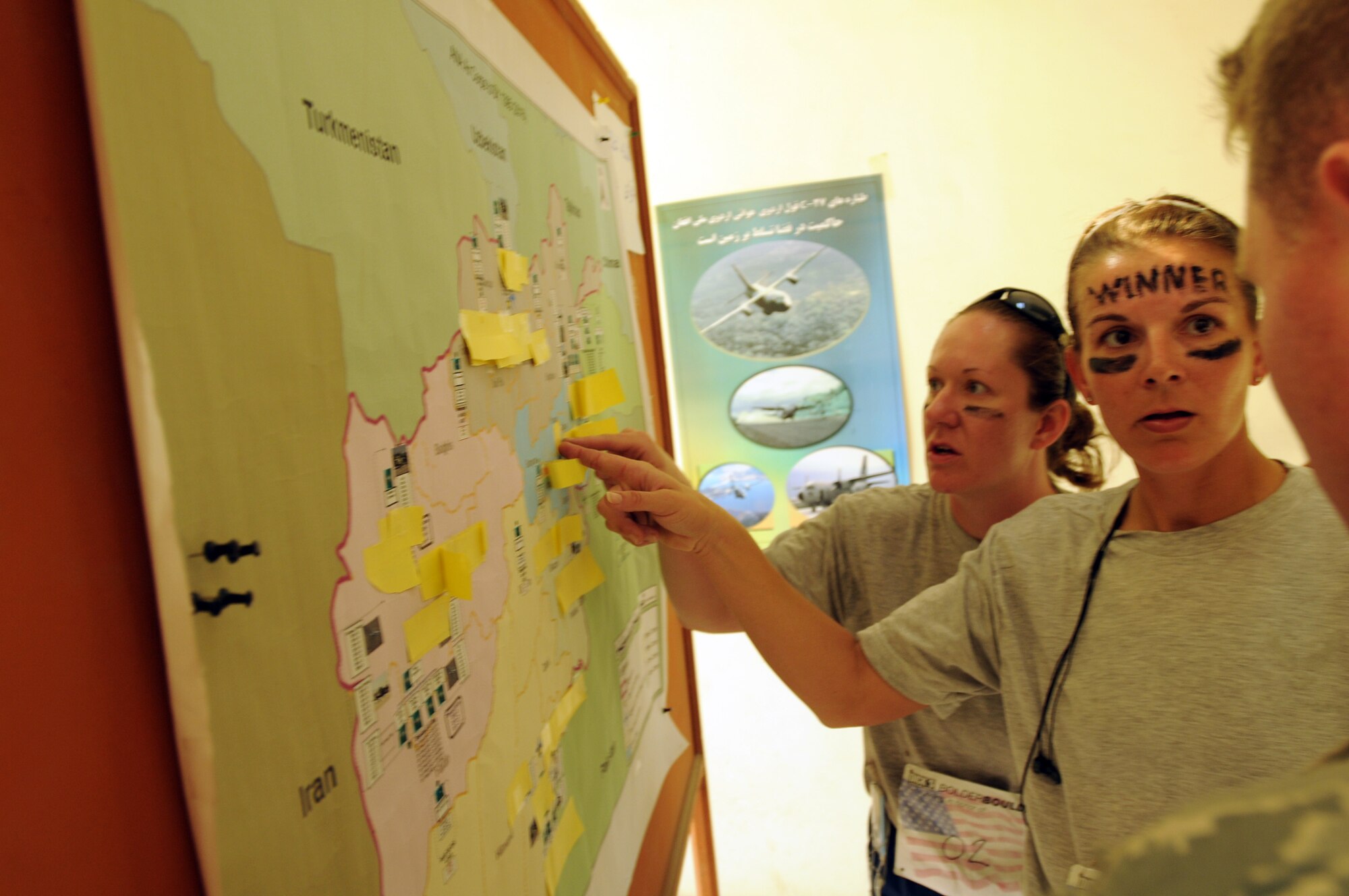 100827-N-6031Q-012 KABUL, Afghanistan - Airmen from the Combined Air Power Transition Force participate in the "Amazing Race" event held jointly at the International Security Assistance Force and Afghan Air Force base's on Aug. 27, 2010. The race was both physically and mentally challenging as the contestants would decipher clues that would lead them to the variety of mixed events during the race including volleyball, face paint and blind ball toss, map reading. (US Navy photo by Mass Communication Specialist 2nd Class David Quillen/ RELEASED).