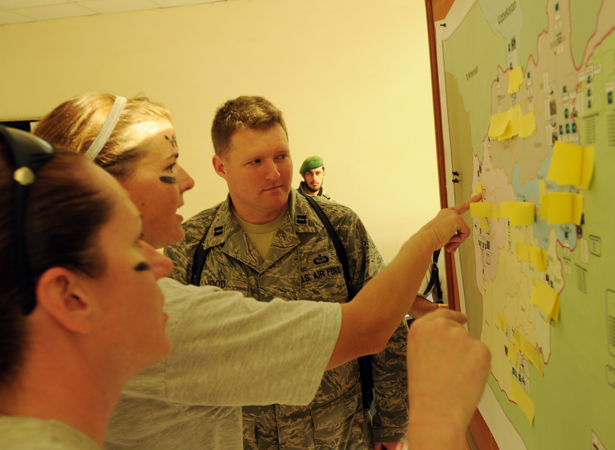 100827-N-6031Q-011 KABUL, Afghanistan - Airmen from the Combined Air Power Transition Force participate in the "Amazing Race" event held jointly at the International Security Assistance Force and Afghan Air Force base's on Aug. 27, 2010. The race was both physically and mentally challenging as the contestants would decipher clues that would lead them to the variety of mixed events during the race including volleyball, face paint and blind ball toss, map reading. (US Navy photo by Mass Communication Specialist 2nd Class David Quillen/ RELEASED).