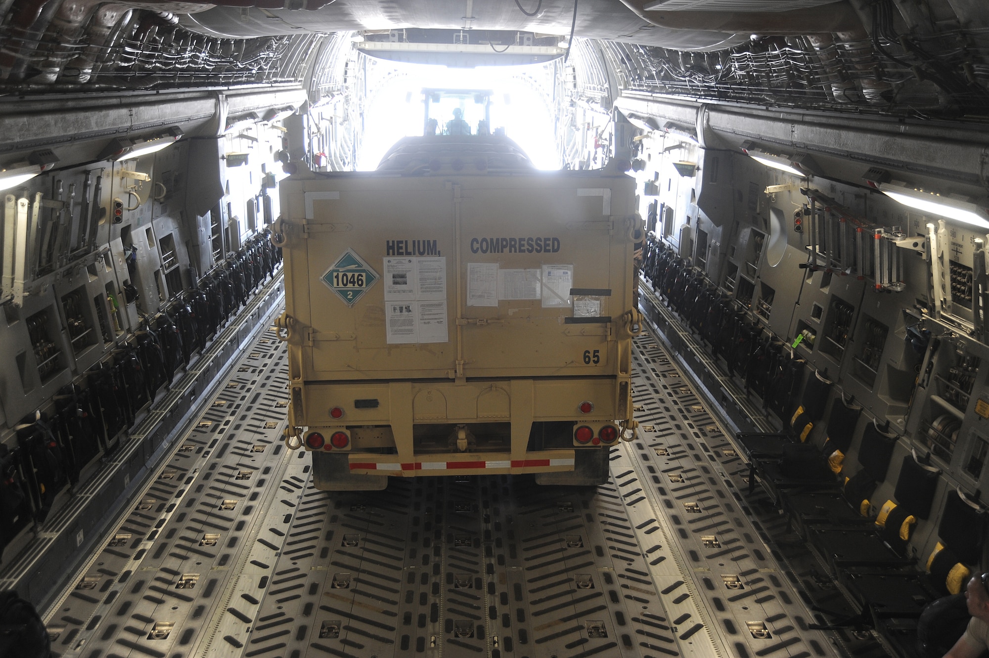 A 25 foot bulk helium trailer is loaded onto a C-17 Globemaster III Aug 24 at a non-disclosed base in Southwest Asia. The 380th Expeditionary Logistics Readiness Squadron delivers approximately 90,000 pounds of helium per week to the Area of Responsibility. (U.S. Air Force Photo/ Staff Sgt. Jeremy Larlee) 