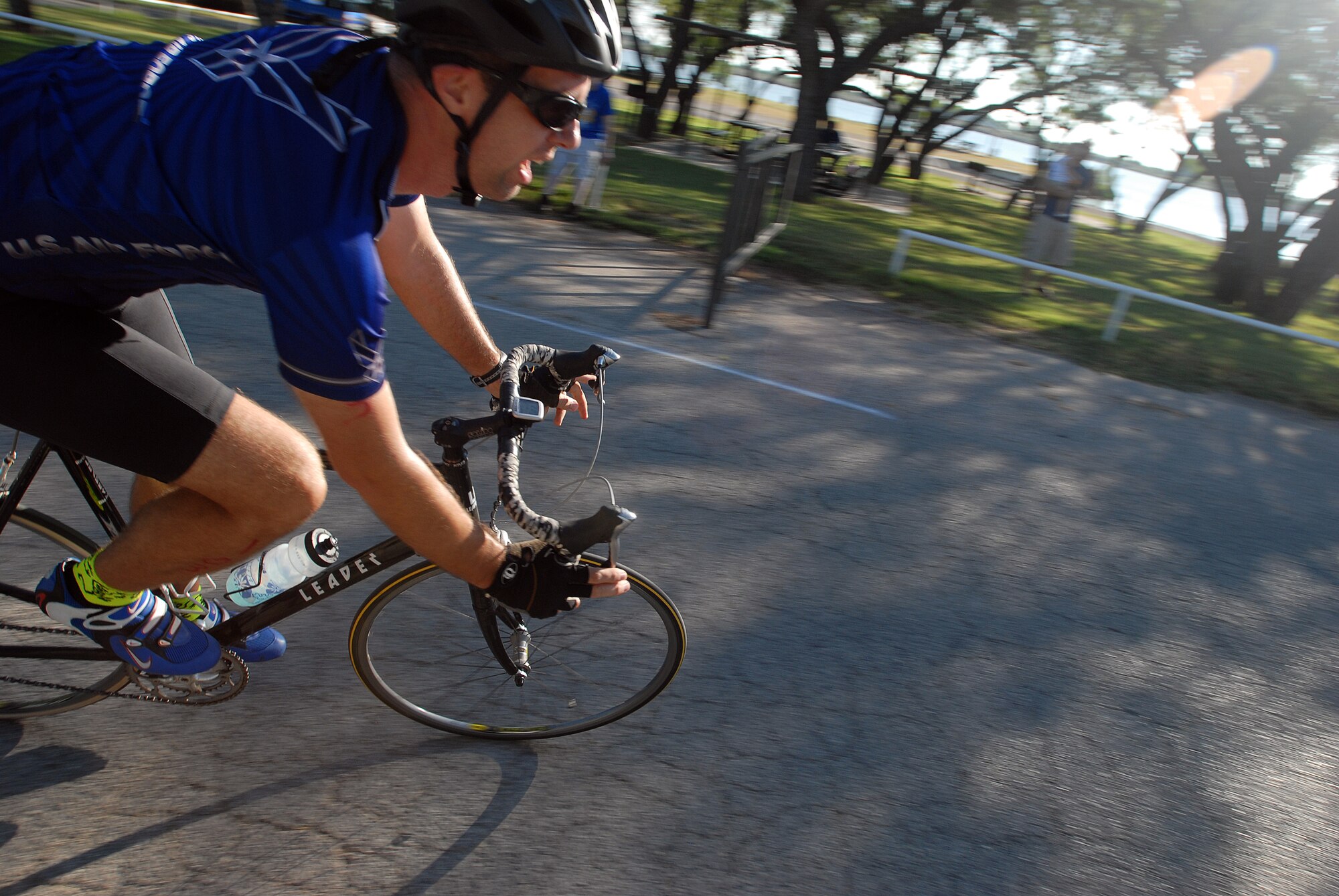 Lt. Col. Jeffery McBride, 312th Training Squadron commander, rounds the final corner of a grueling 20-kilometer bike ride during the 2010 Triathlon Aug. 21.  The triathlon, open to military and the community, was comprised of a 400-meter swim, 20-kilometer bike ride, and a 5-kilometer run.  (U.S. Air Force photo/ Master Sgt Randy Mallard)