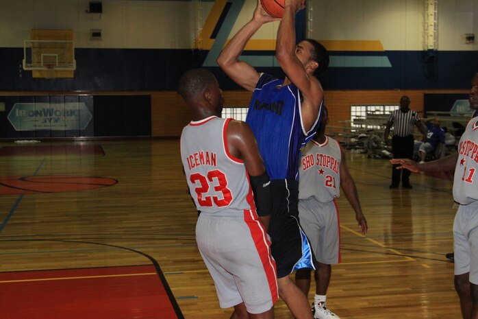 John K. Ayers Jr., Fil-Am point guard, goes for a jump shot while being guarded by Nathan Rozzelle, Sho Stoppaz forward, during the second 2010 All-Star Basketball Tournament at the IronWorks Gym here Aug. 28.
