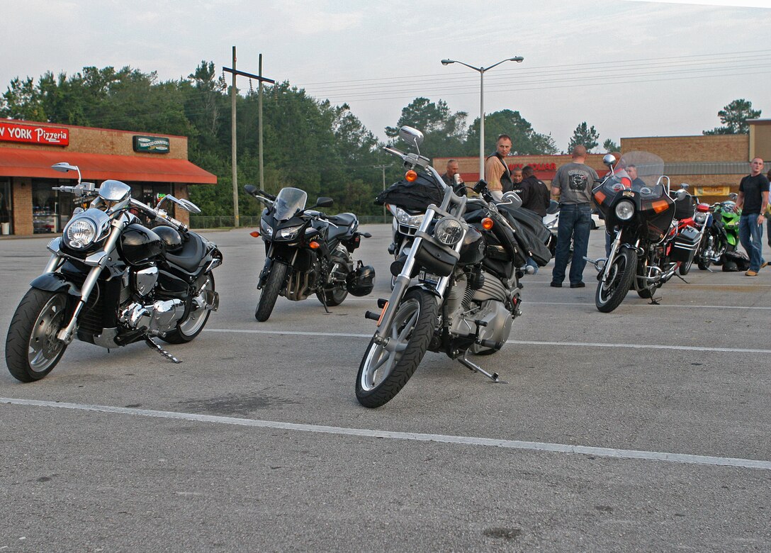 Members of the II Marine Expeditionary Force Headquarters Group motorcycle mentorship program gather in a parking lot in New River, N.C., before their ride to Myrtle Beach, S.C., Aug. 27, 2010. Motorcycle owners in II MHG participate in periodic rides together, where they not only talk about safety on the road, but also put their words into action.