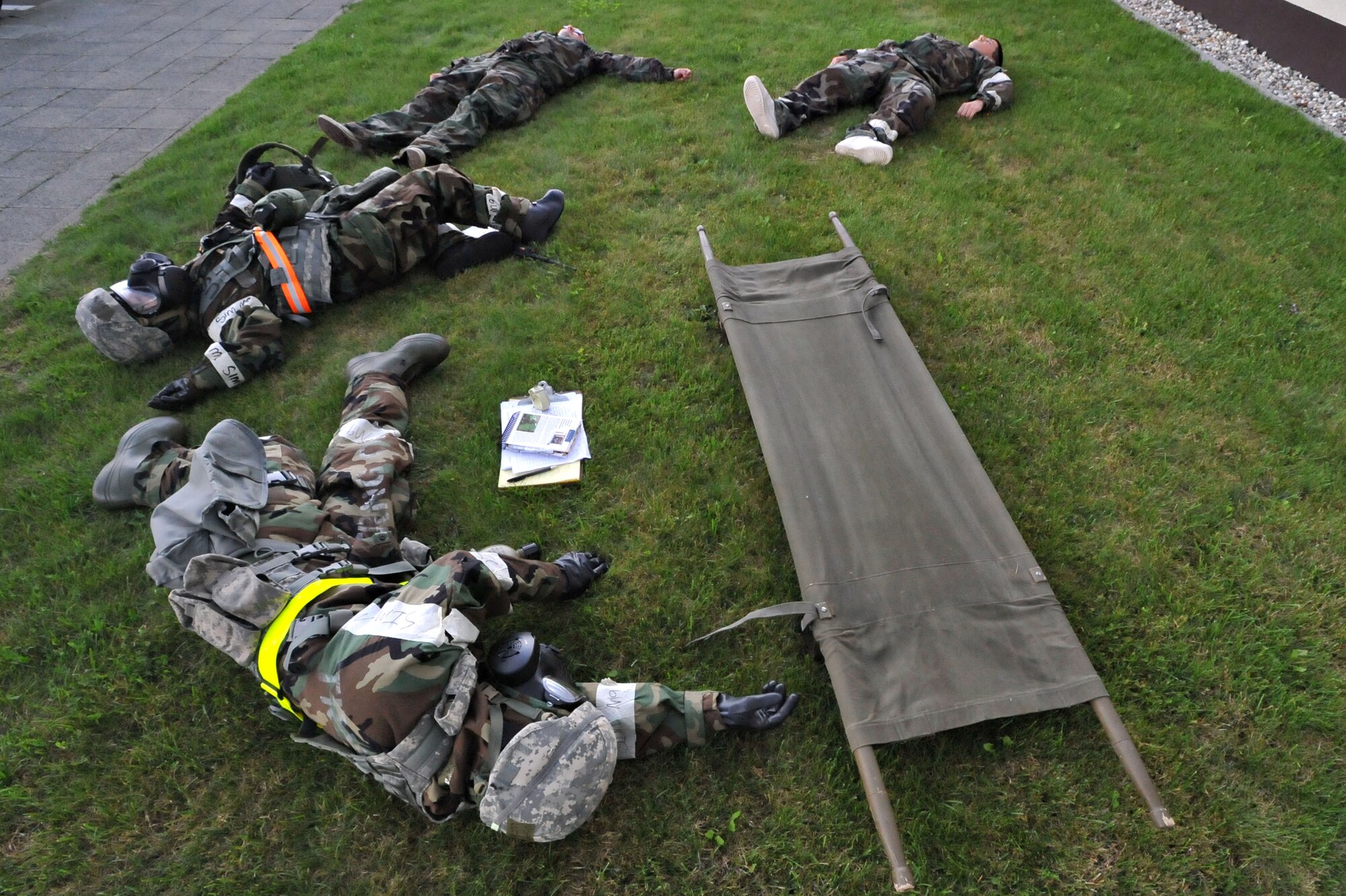 U. S. Air Force 86th Security Forces Squadron par team simulated dead after a nerve agent chemical attack during an operational readiness exercise, Ramstein Air Base, Germany, Aug. 28, 2010. An ORE incorporates a series of scenarios to evaluate a base's ability to execute operational duties under simulated wartime conditions. (U.S. Air Force photo by Airman 1st Class Desiree Esposito)