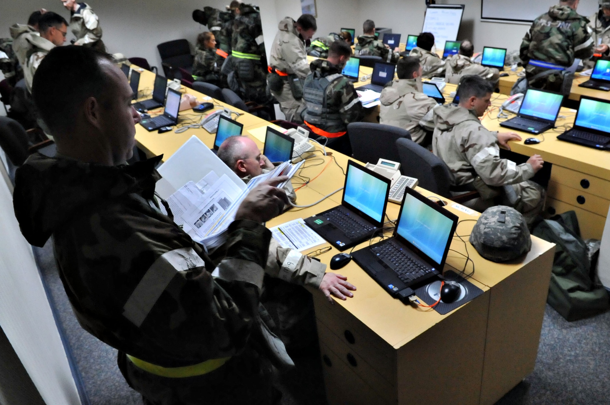 U.S. Air Force 86th Airlift Wing members, evacuate to the alternate command post during an operational readiness exercise, Ramstein Air Base, Germany, Aug. 28, 2010. An ORE incorporates a series of scenarios to evaluate a base's ability to execute operational duties under simulated wartime conditions. (U.S. Air Force photo by Airman 1st Class Desiree Esposito)