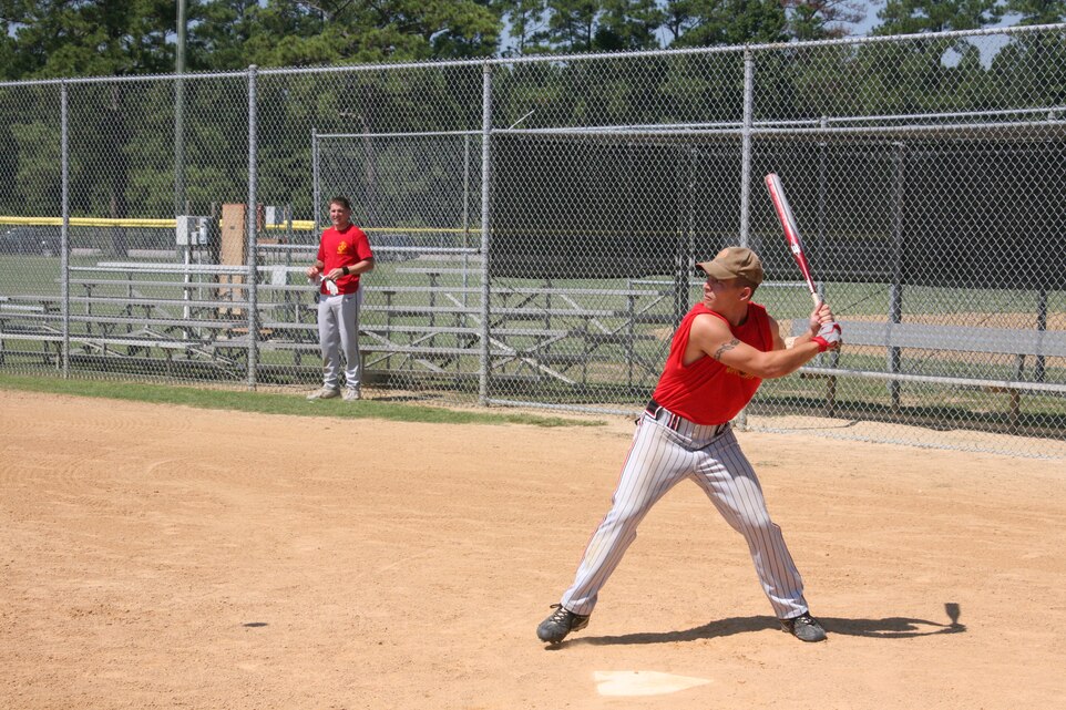Sgt. Doug Pearson begins his swing at the first practice for the All-Marine softball team candidates at Marine Corps Air Station Cherry Point Aug. 30. Pearson and a Cherry Point Sailor, Petty Officer 3rd Class Bobby Brown, were selected from a group of more than 100 Marines and Sailors who participated in the East Coast Regional Tournament.